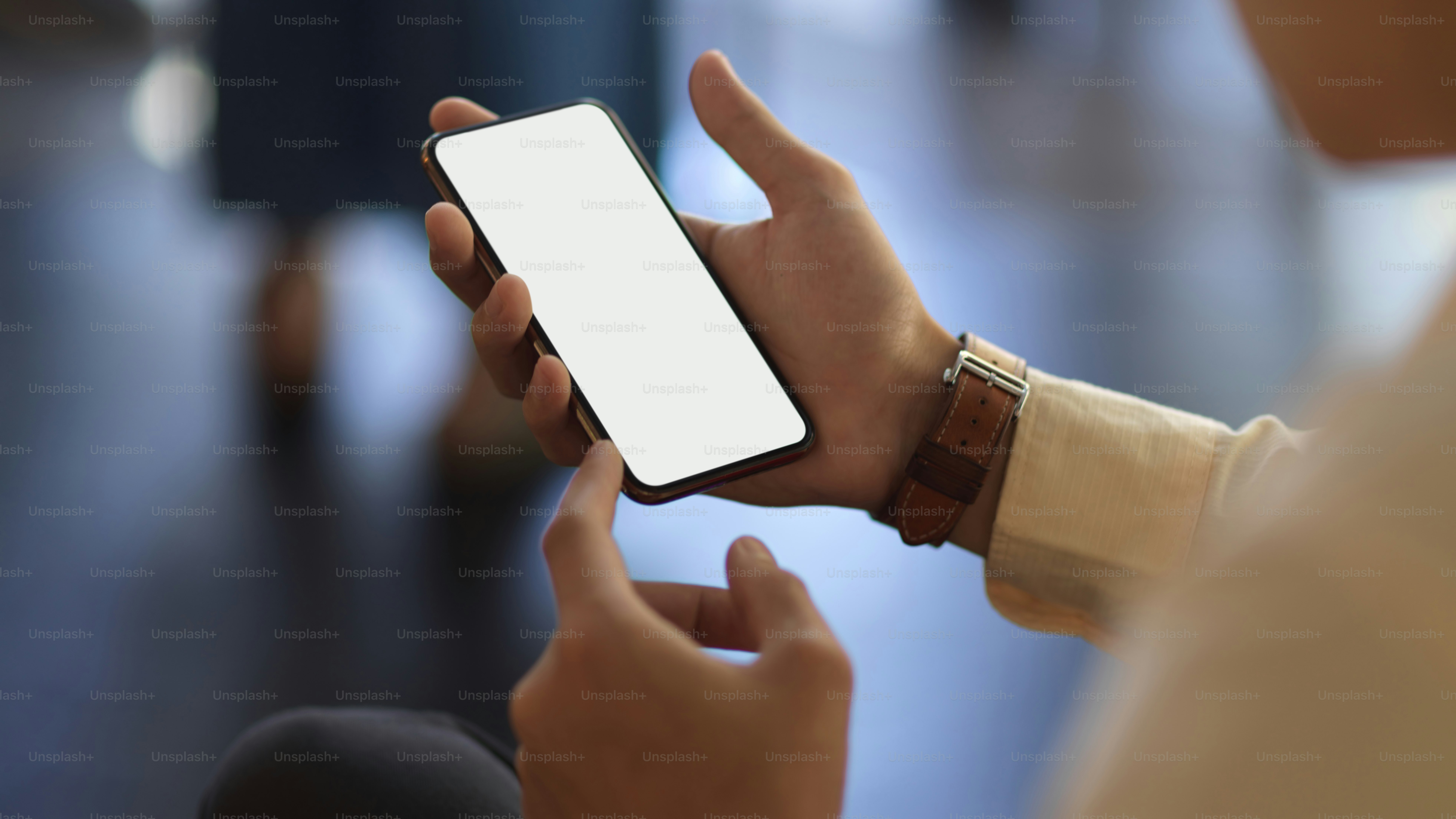 Close up view of businessman hands using smartphone while relaxed ...