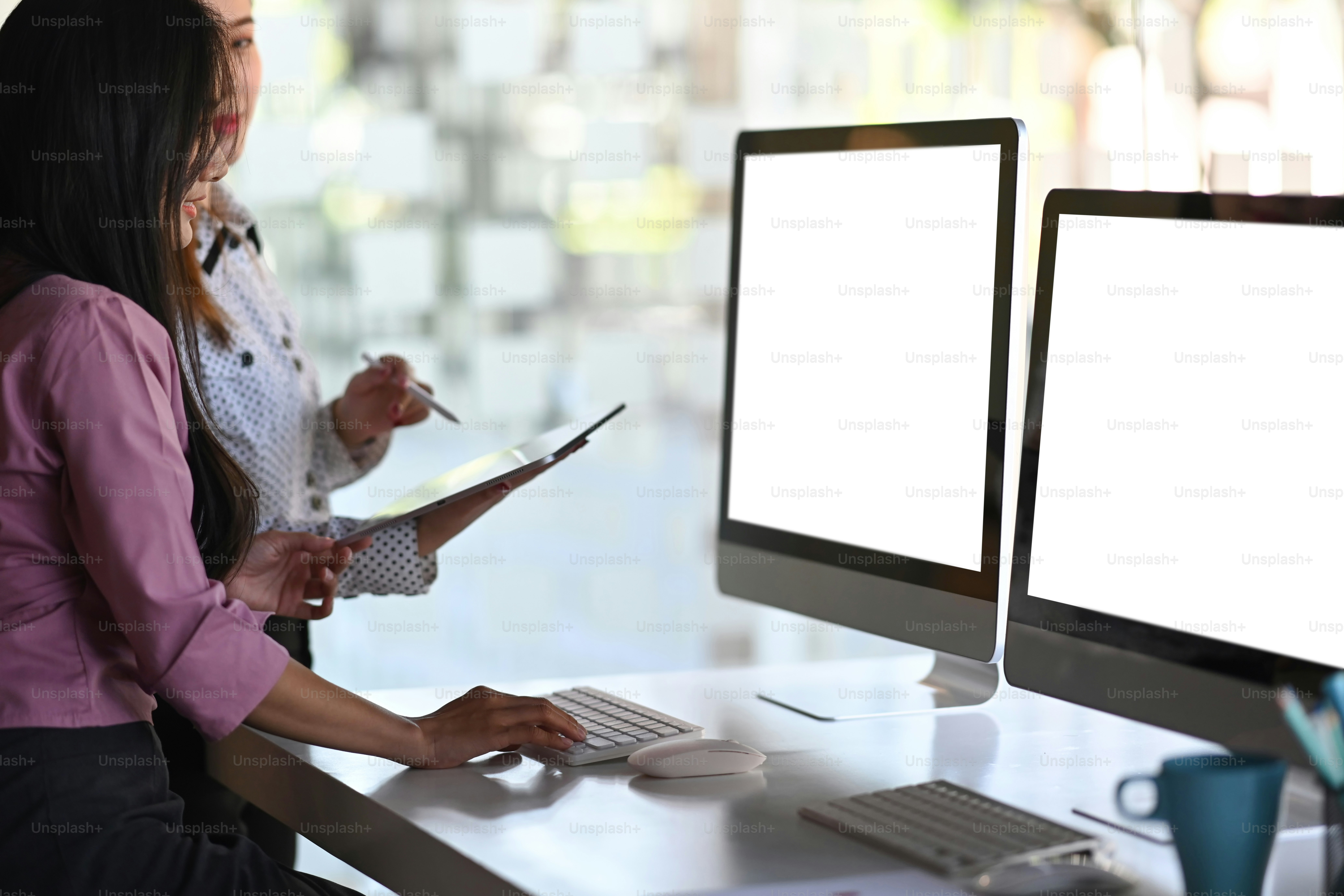 Businesspeople are collaborating and talking through new ideas while ...