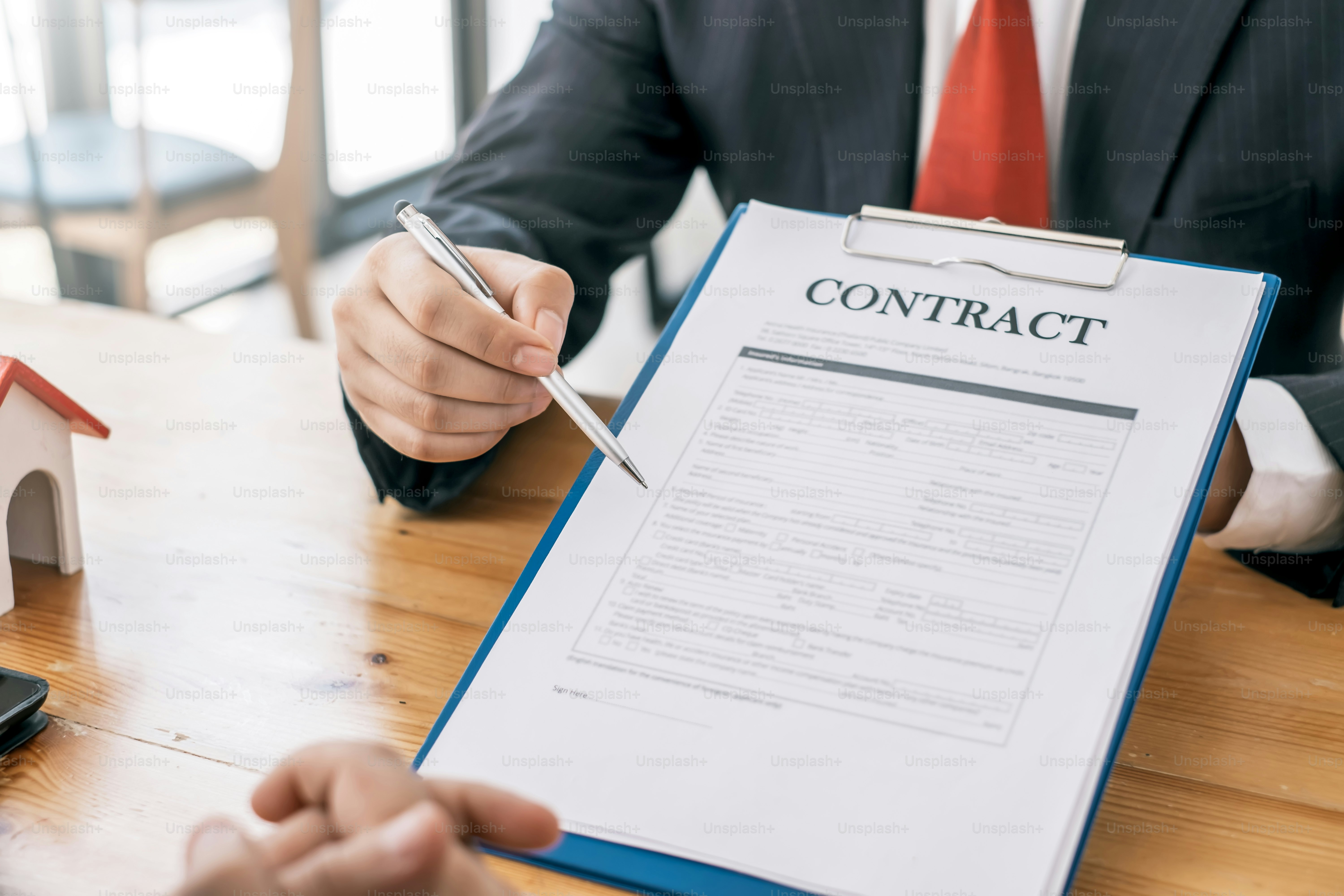 Signing a contract to buy or sell real estate