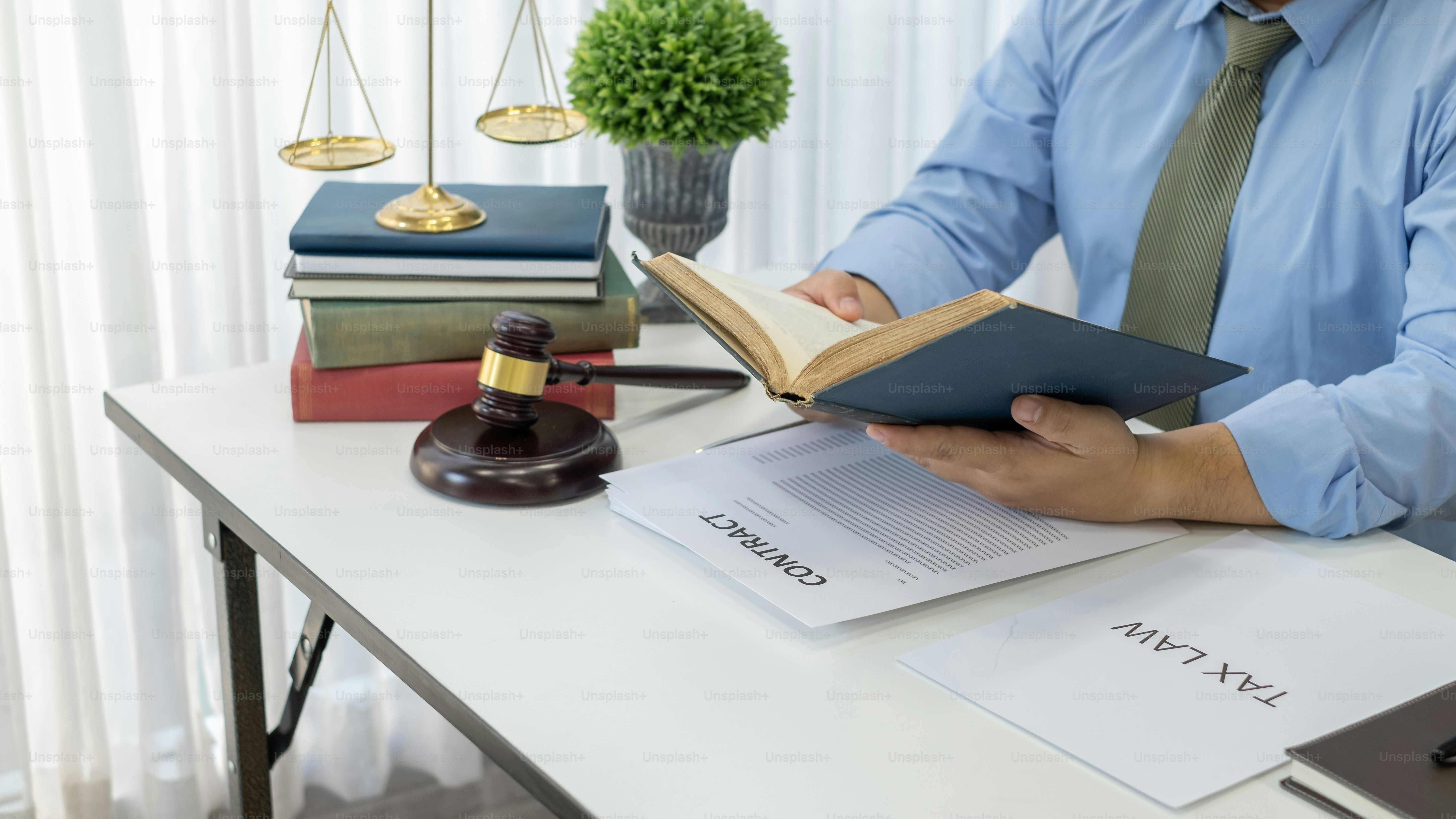Business lawyer working about legal legislation in courtroom to help their customer.