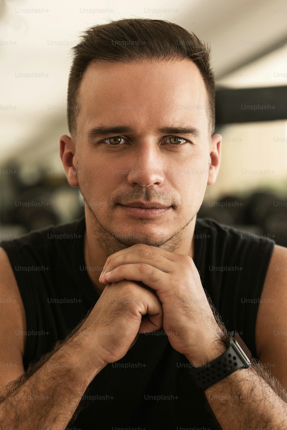 Indoors portrait of young handsome man wearing sport clothes