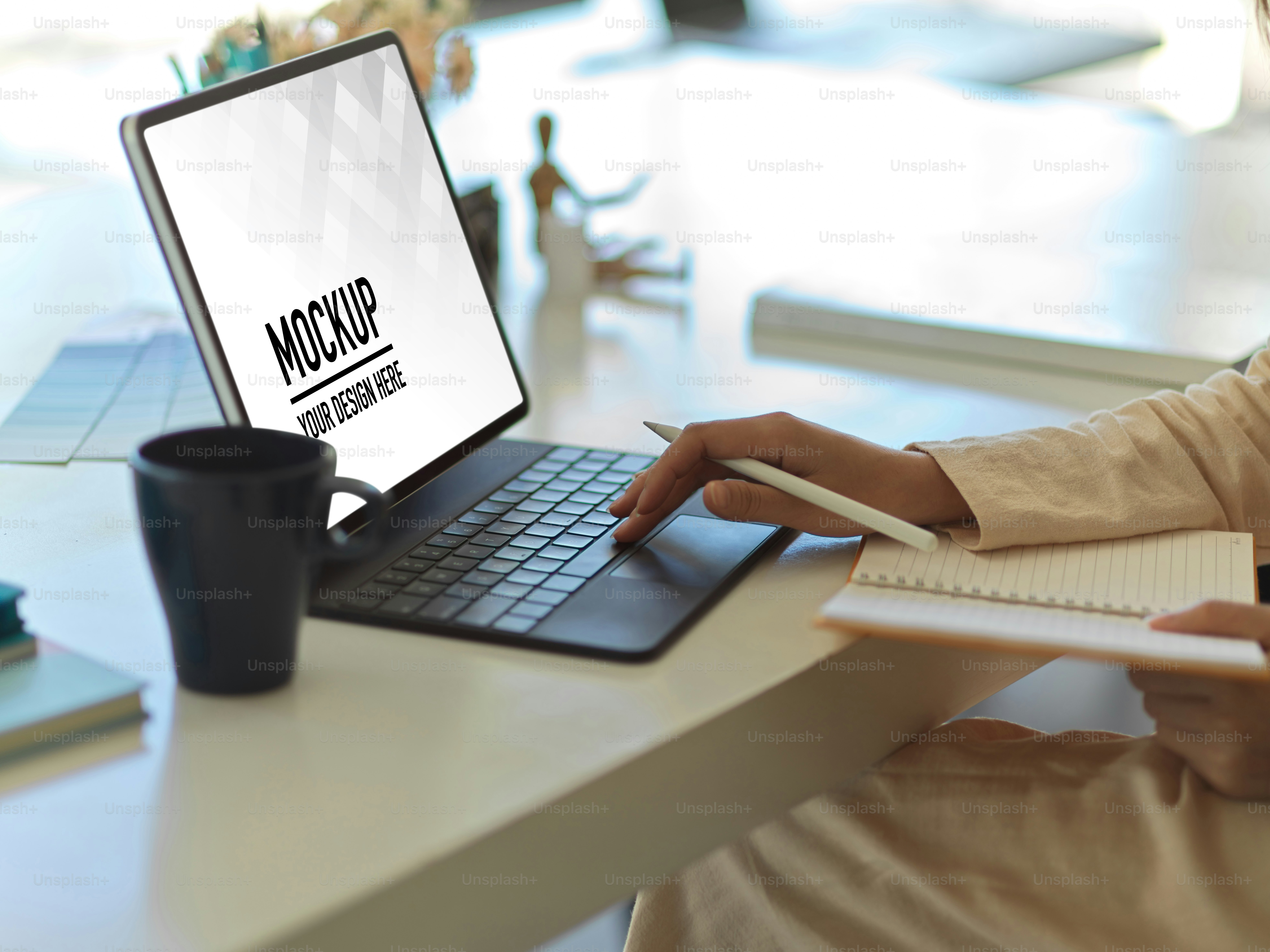 Close up view of businesswoman hand working with digital tablet and schedule book