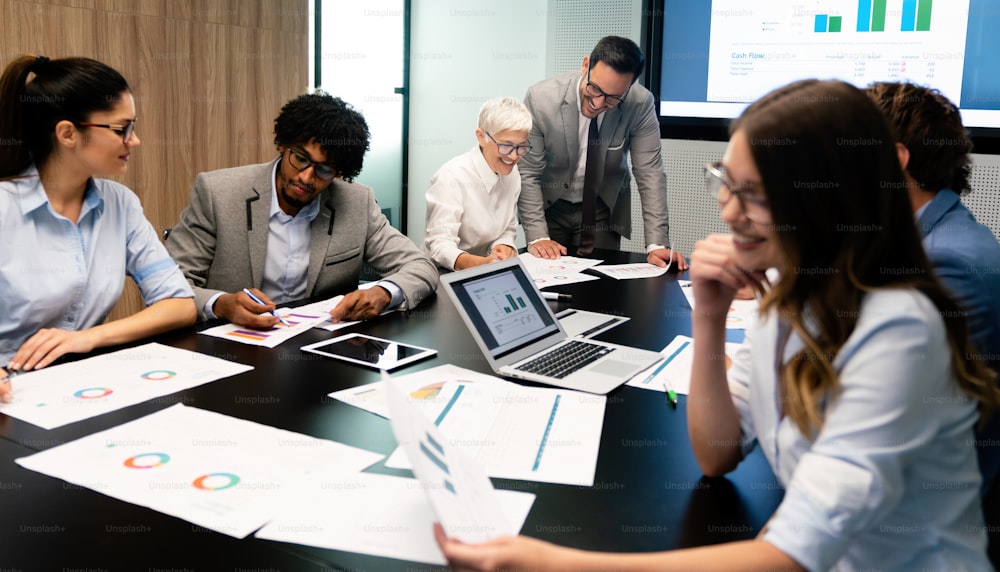 Group of business colleagues in conference meeting room during presentation