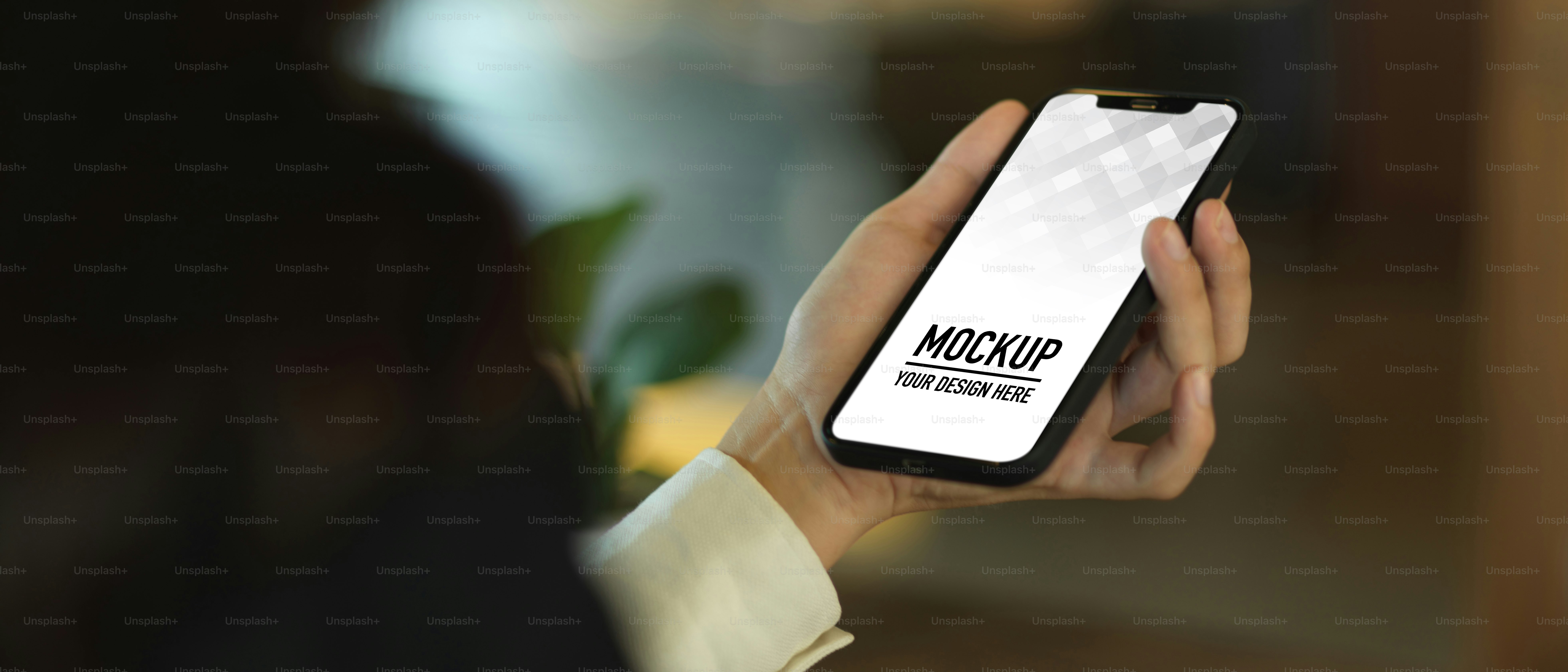 Close up view of female hand holding smartphone in blurred background, include clipping path