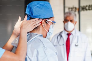 Latin woman doctor preparing to enter surgery in a hospital in Mexico