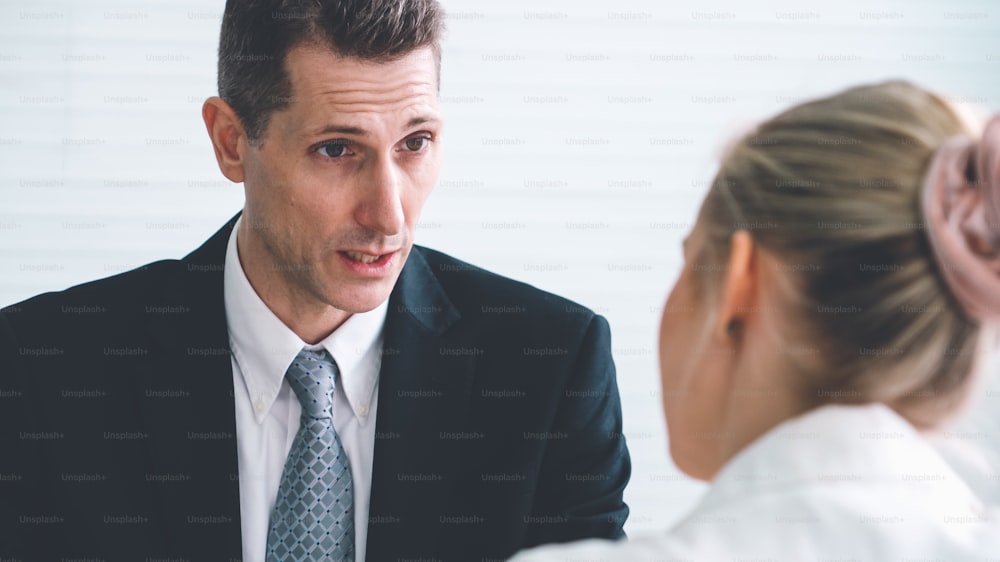 Job seeker in job interview meeting with manager and interviewer at corporate office. The young interviewee seeking for a professional career job opportunity . Human resources and recruitment concept.