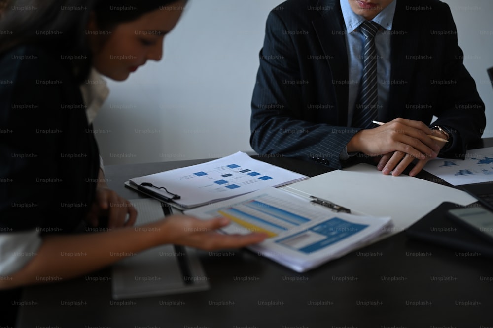 Cropped shot of business partners meeting and discussing for new project investments and sale performance.