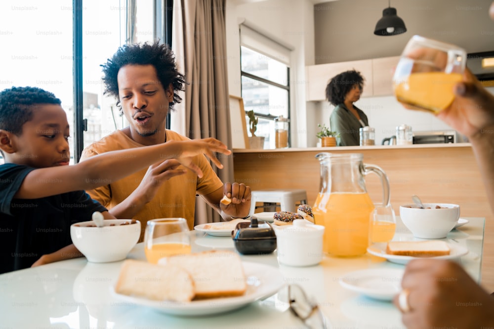 Portrait of African american family having breakfast together at home. Family and lifestyle concept.