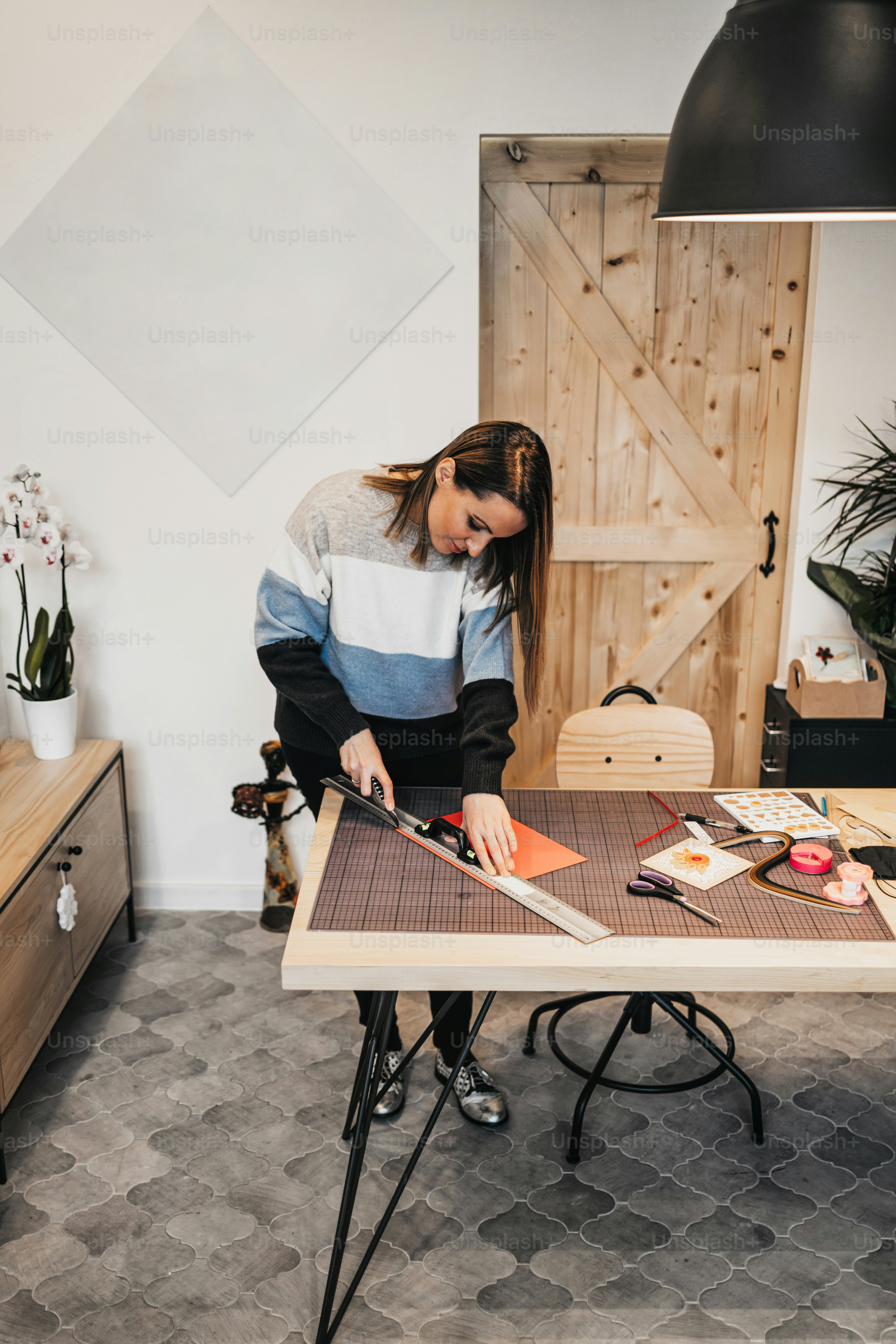 Paper art designer and artist working in her studio or workshop.