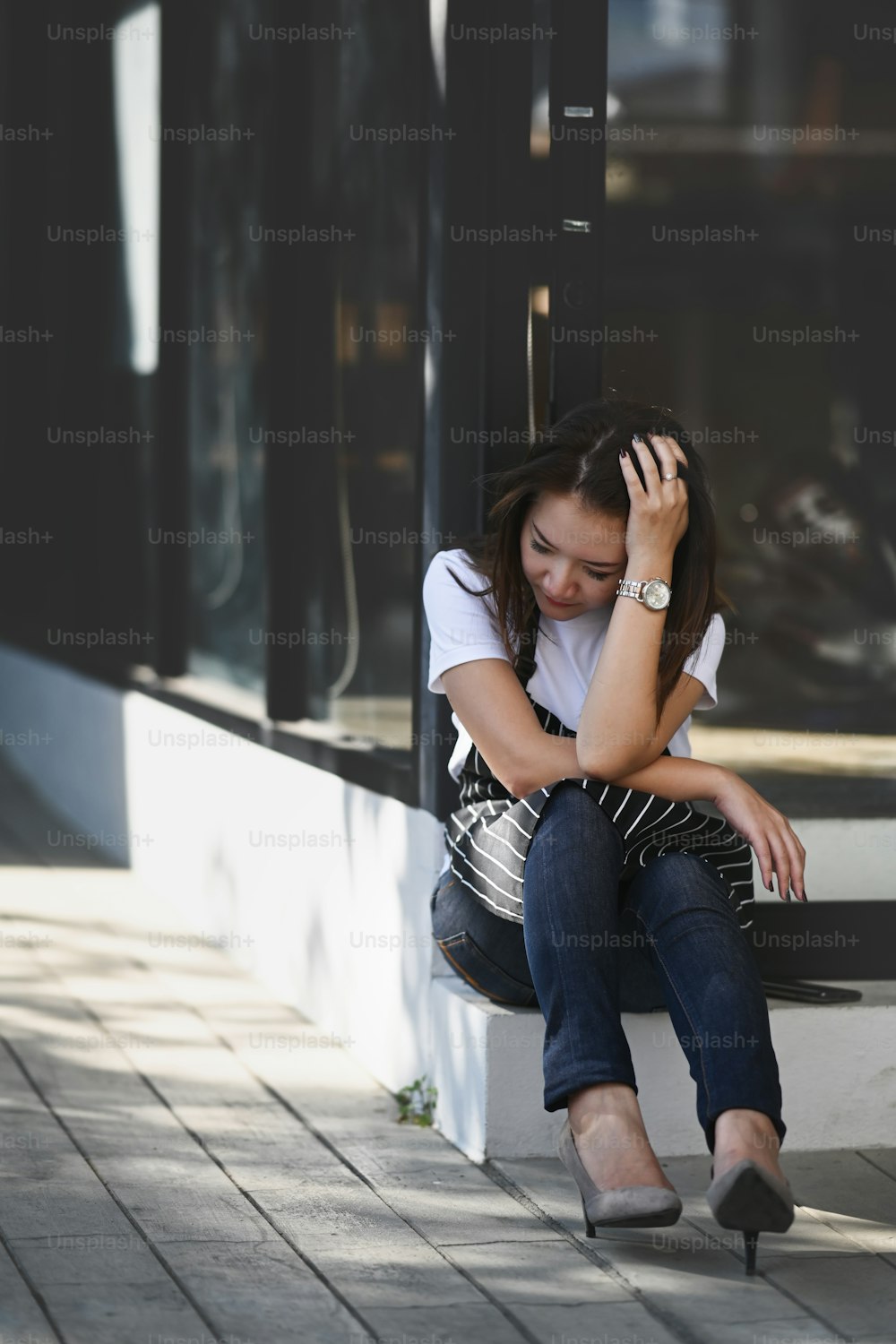 Portrait of Asian woman coffee shop entrepreneur stressed because of economic conditions and business losses.