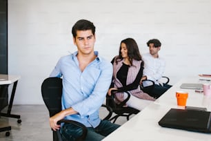 latin business people meditating and doing yoga in office in Mexico city