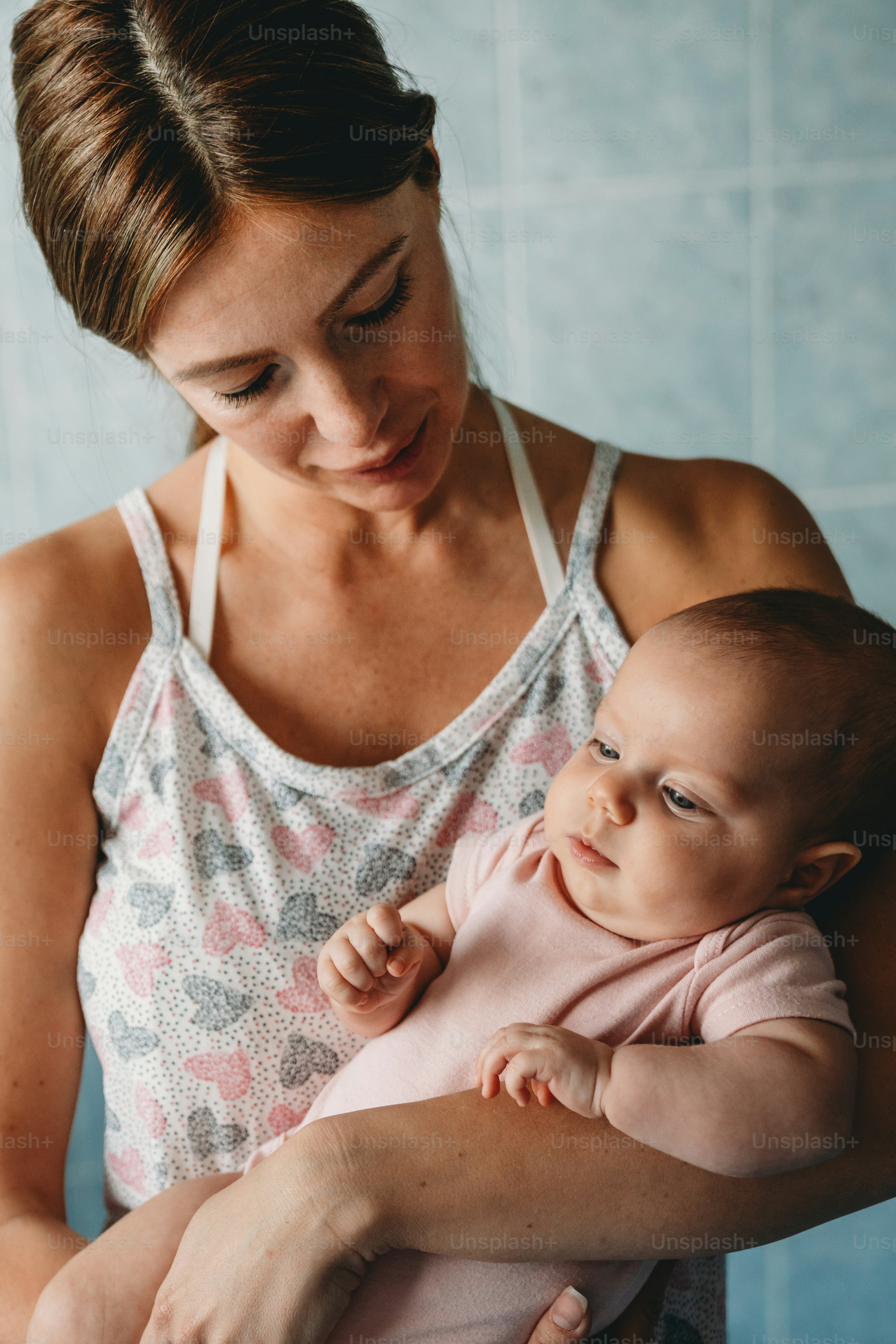 Happy cheerful family. Mother and baby kissing, laughing and hugging together