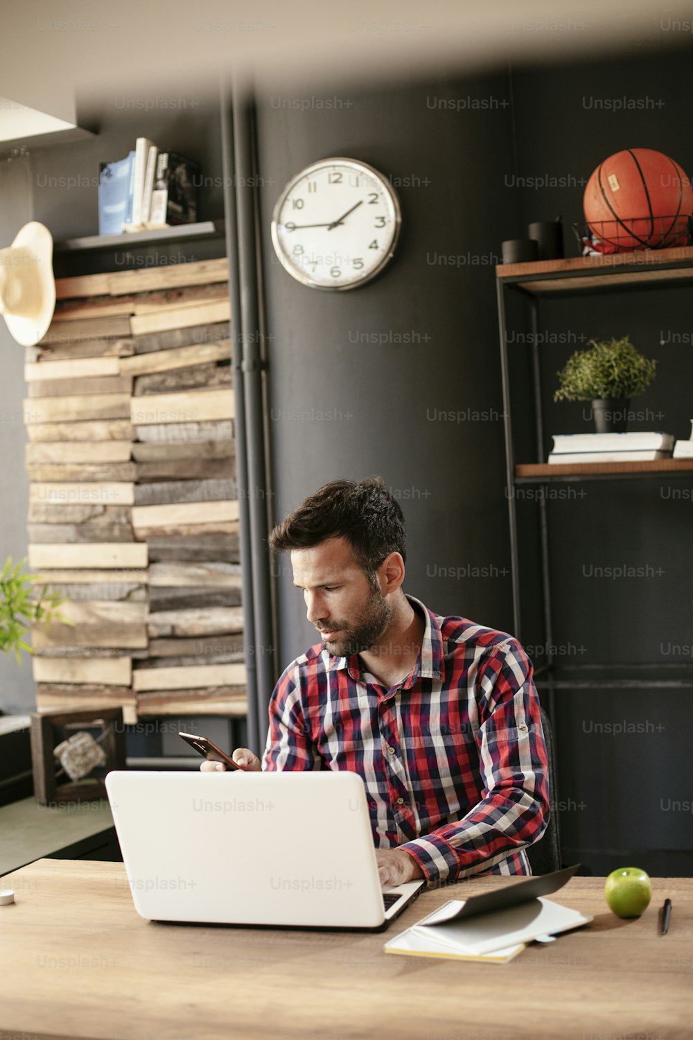 Businessman working in the office on his laptop. Stylish businessman working on a project in the office.