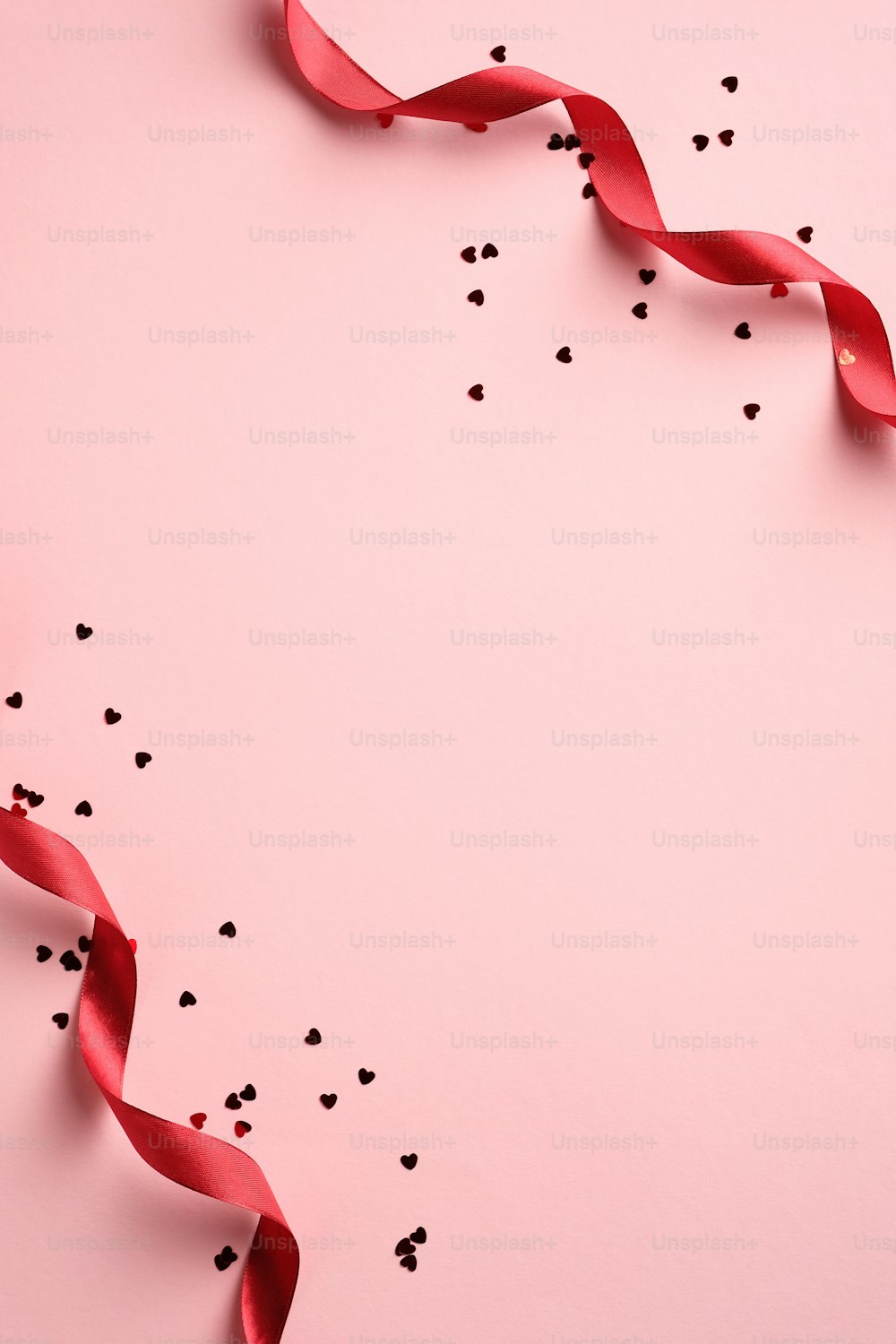 Happy Valentine's Day concept. Vertical banner design with red ribbons and heart shaped confetti on pink background. Holiday brochure design, greeting card, gift voucher template. Minimal style.