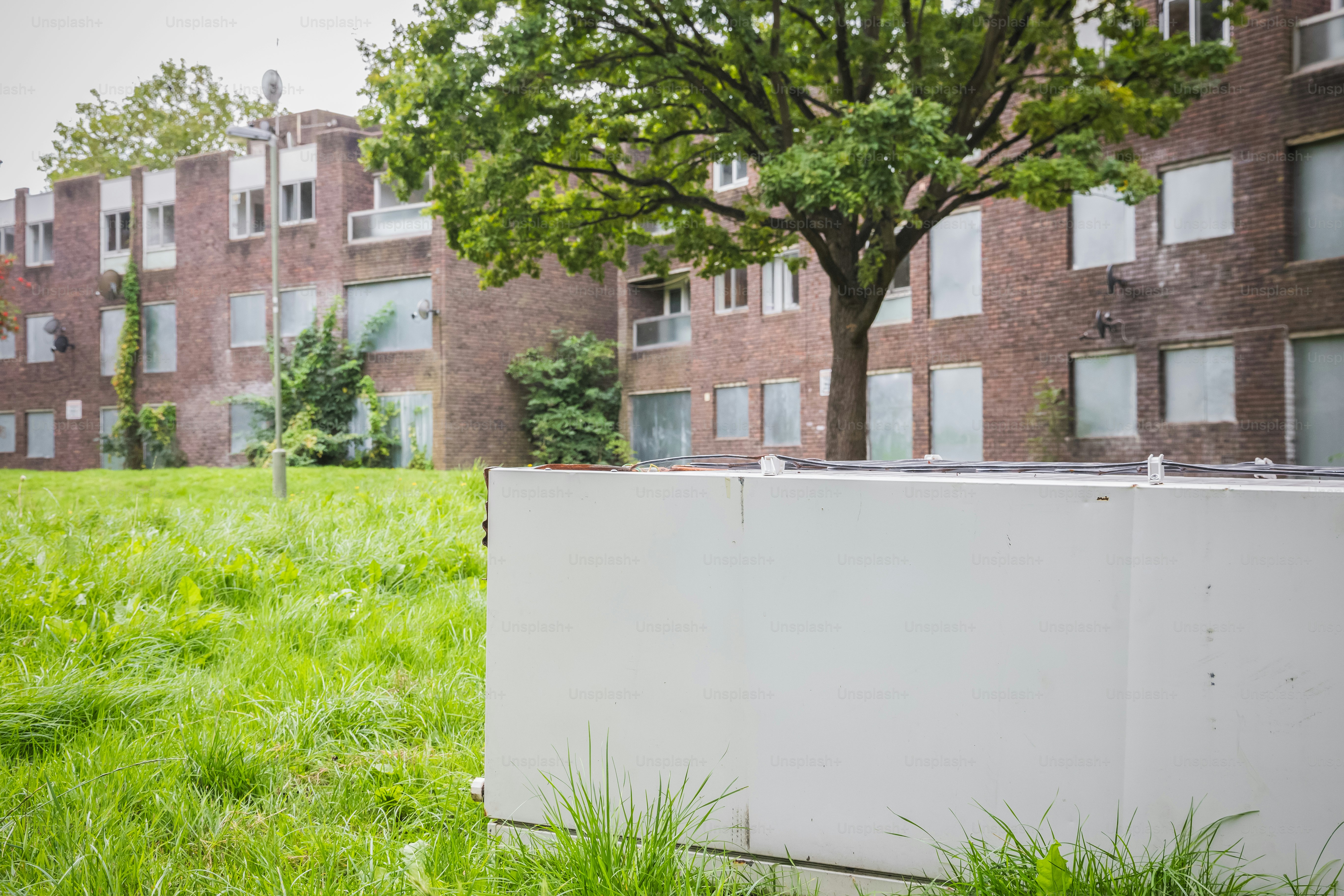 A damaged refrigerator abandoned at disused part of the Grahame Park housing Estate in North London