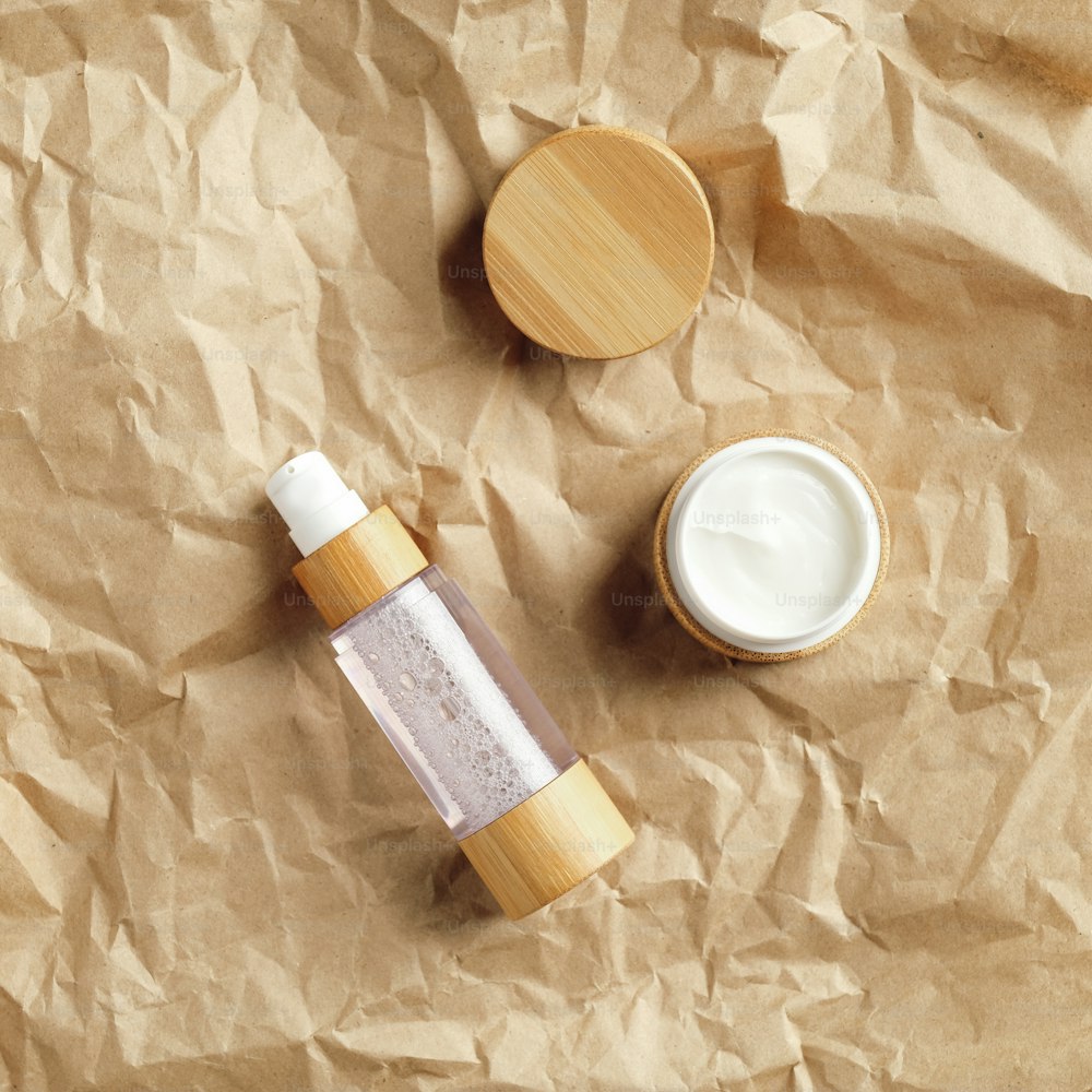 Eco-friendly natural cosmetics set on crumpled paper Flat lay, top view.
