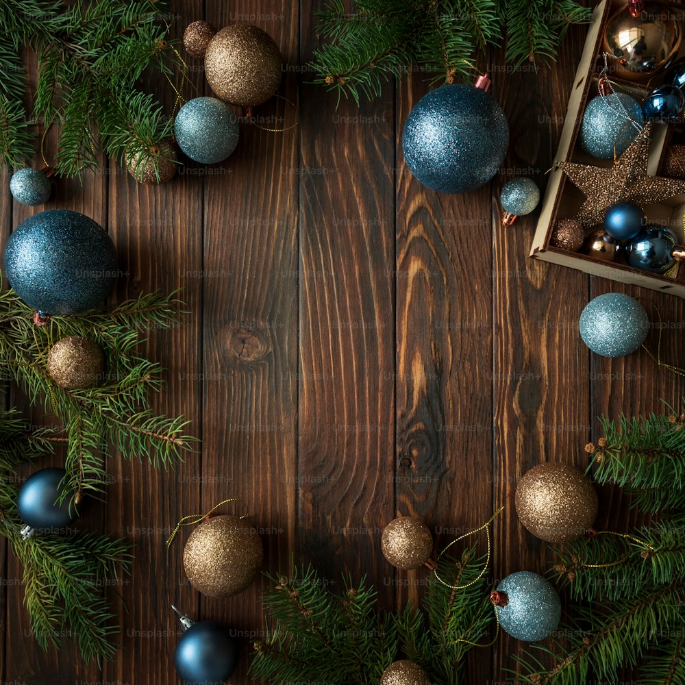 Christmas background with decorations on wooden background. Top view. Copy space.  Merry christmas and happy new year celebration concept. Mock-up
