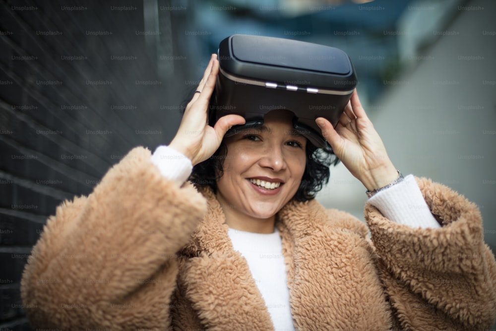 Women testing Virtual Reality simulator on the street.