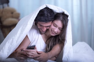 Funny couple in bed