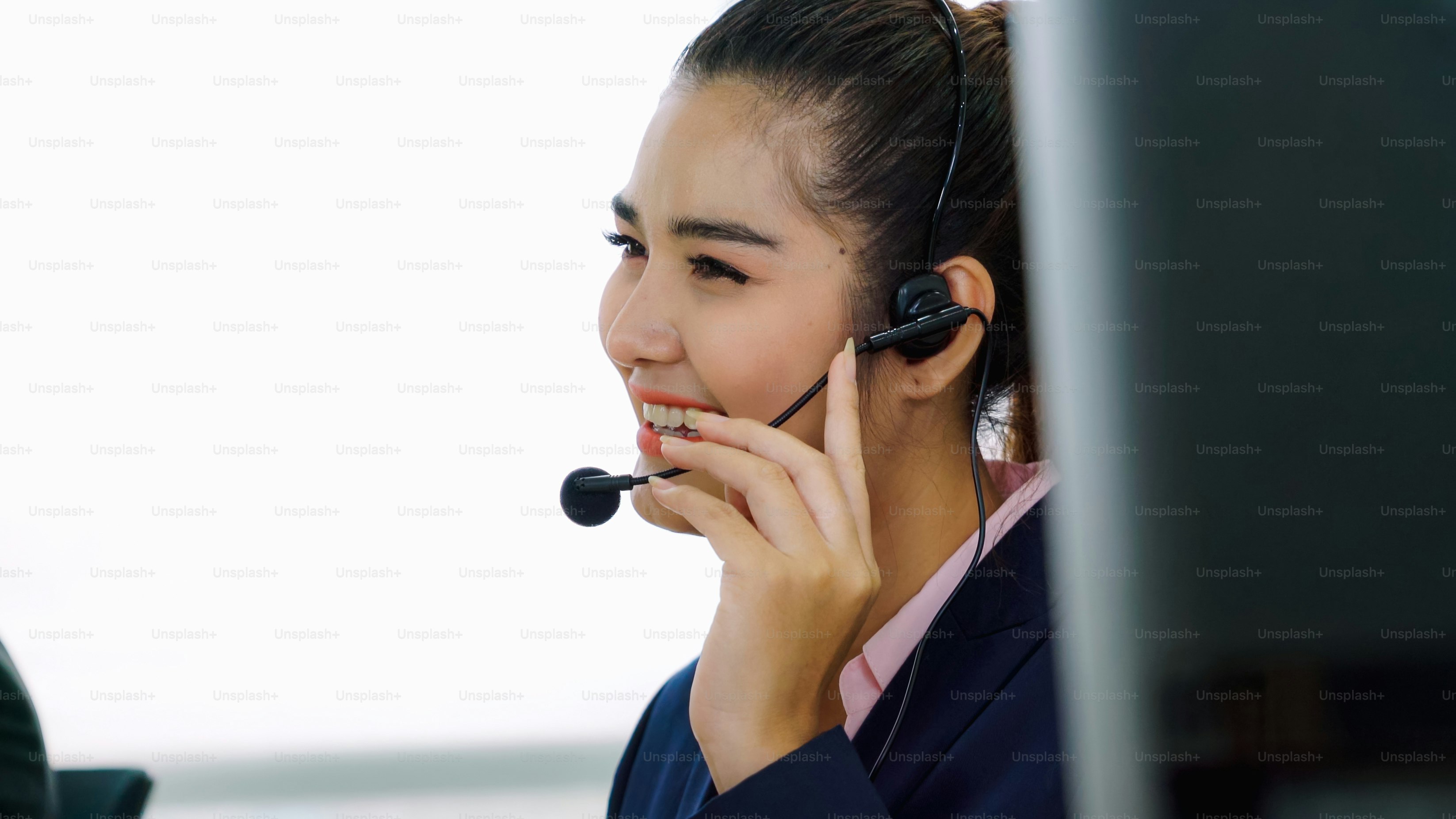 Business people wearing headset working in office to support remote ...