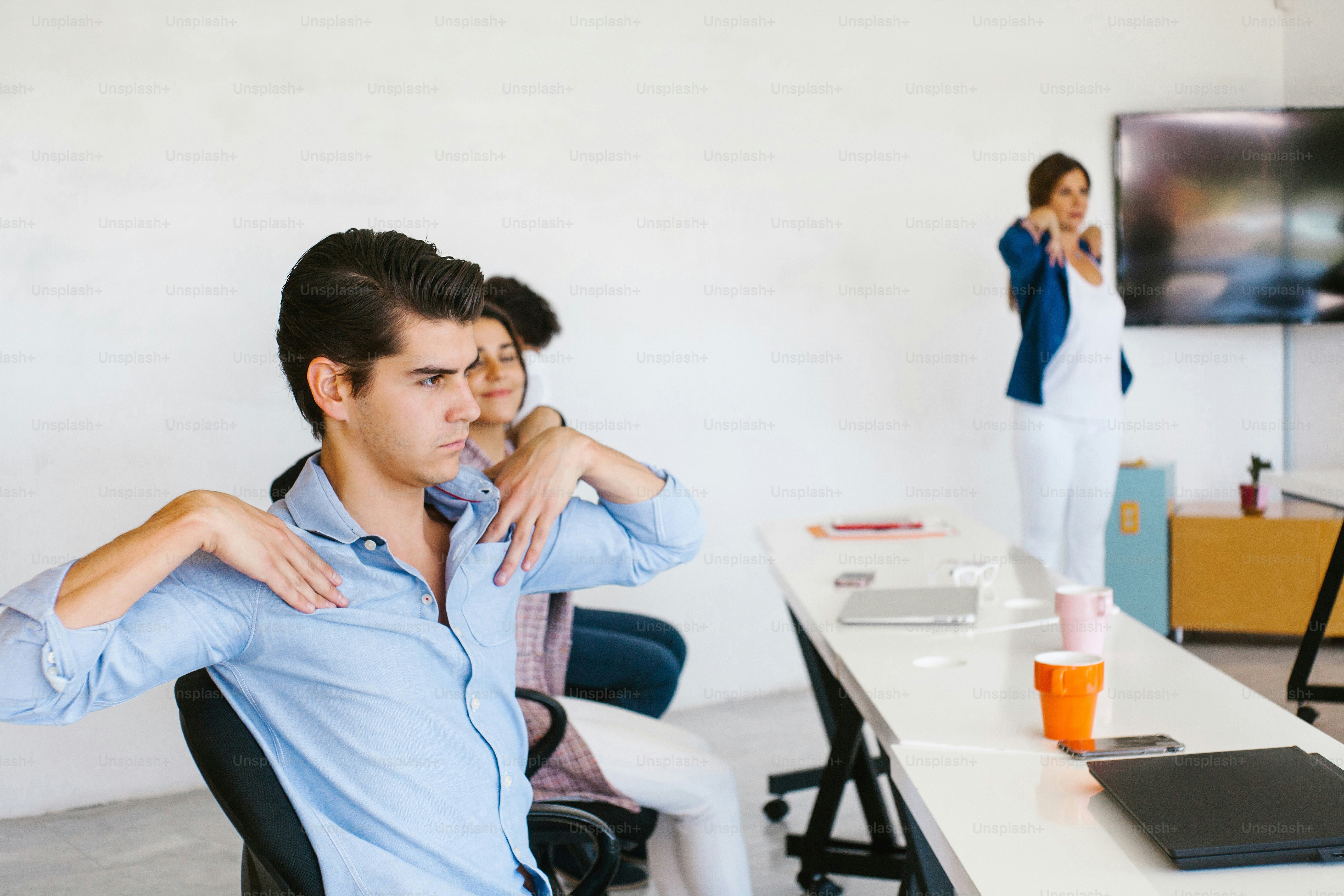latin business people meditating and doing yoga in office in Mexico city