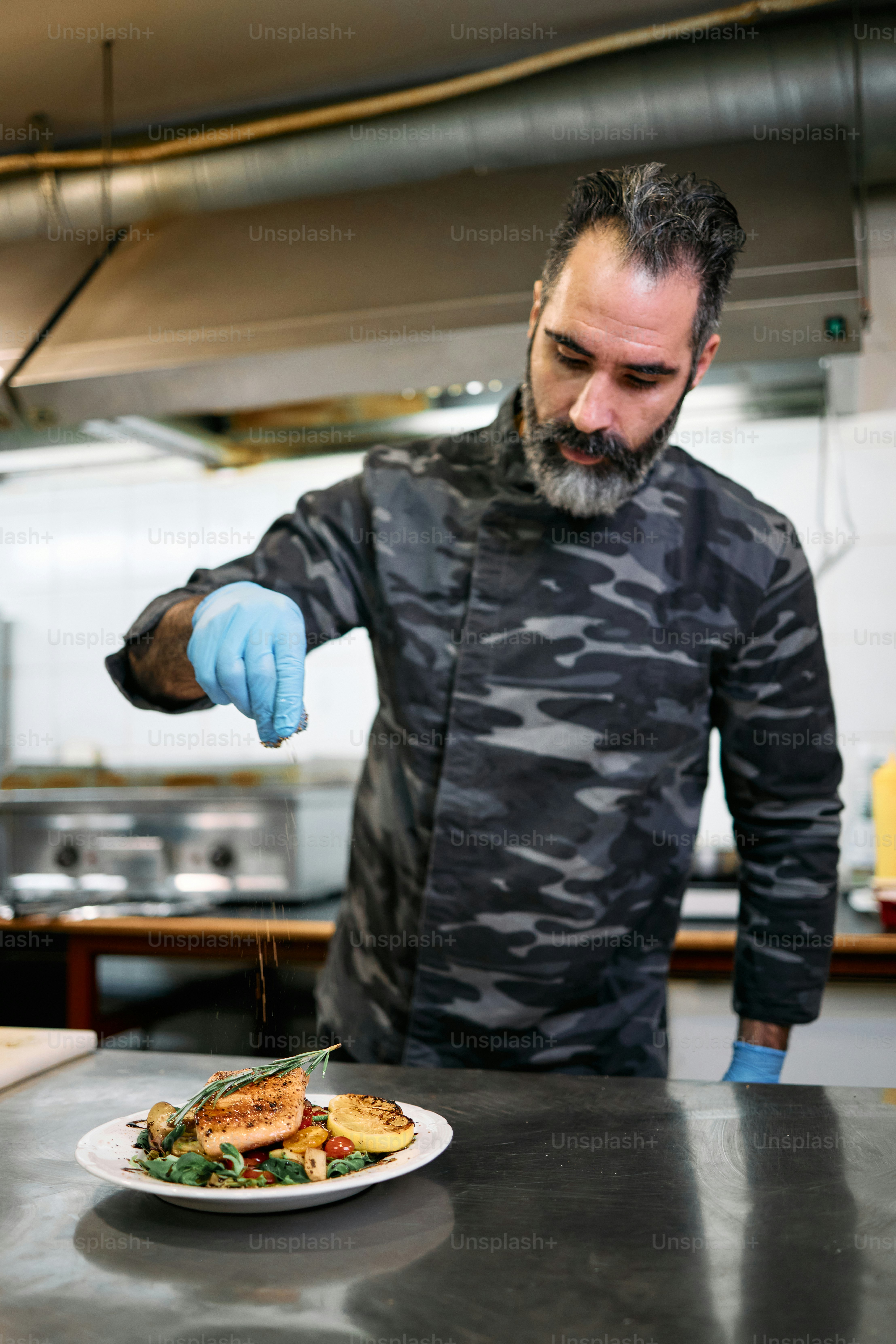 Professional military base chef or cook holds delicious tasty meal with ...