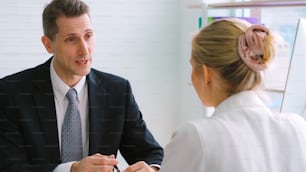 Job seeker in job interview meeting with manager and interviewer at corporate office. The young interviewee seeking for a professional career job opportunity . Human resources and recruitment concept.