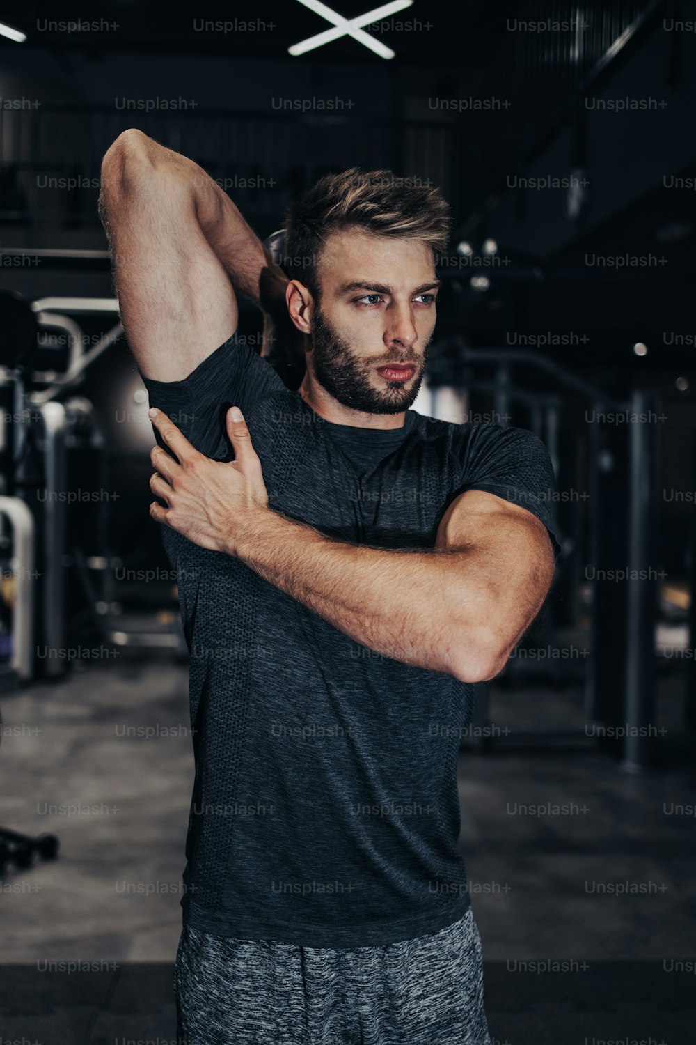 Premium Photo  Shirtless man doing tricep curls with dumbbells in gym  triceps workout