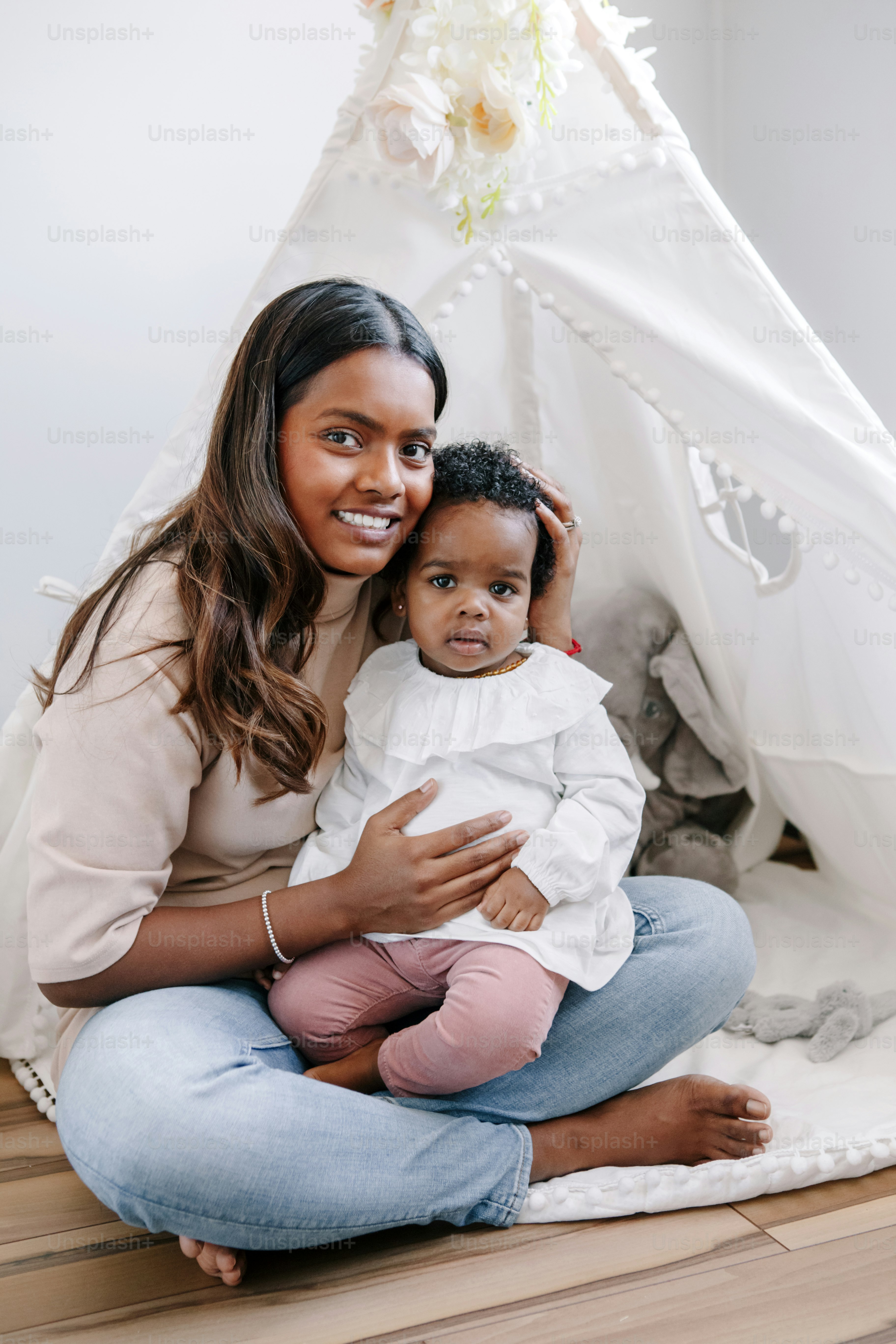 Happy smiling young Indian mother playing with black baby girl daughter.  Family mixed race people mom and kid together hugging at home. Authentic  candid lifestyle with infant kid child. photo – Family, image size:3000x4500