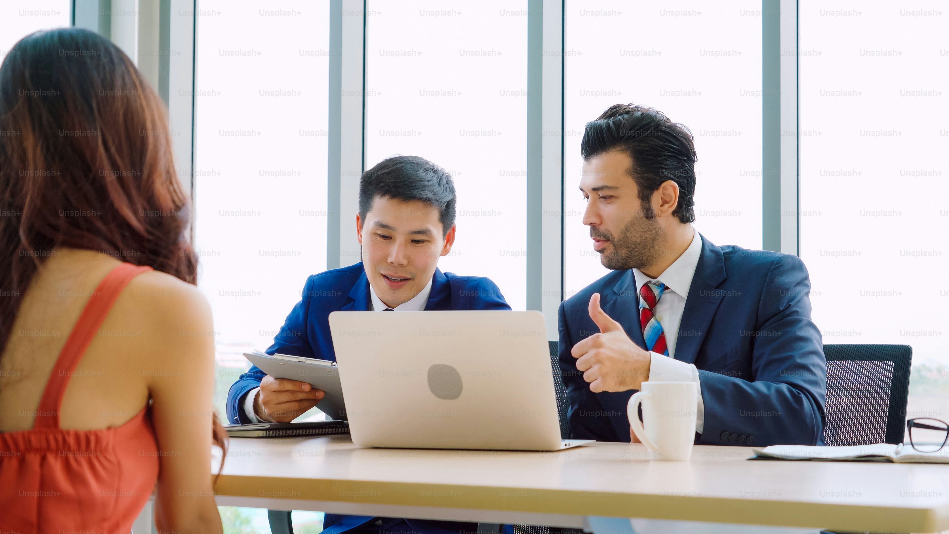 Job seeker in job interview meeting with manager and interviewer at corporate office. The young interviewee seeking for a professional career job opportunity . Human resources and recruitment concept.