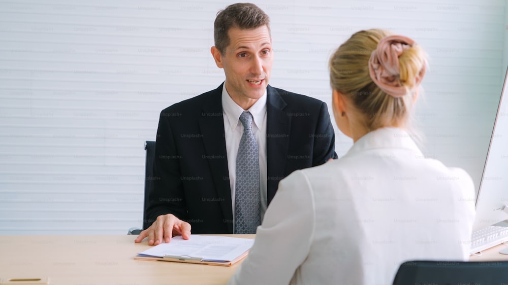 Job seeker in job interview meeting with manager and interviewer at corporate office. The young interviewee seeking for a professional career job opportunity . Human resources and recruitment concept.