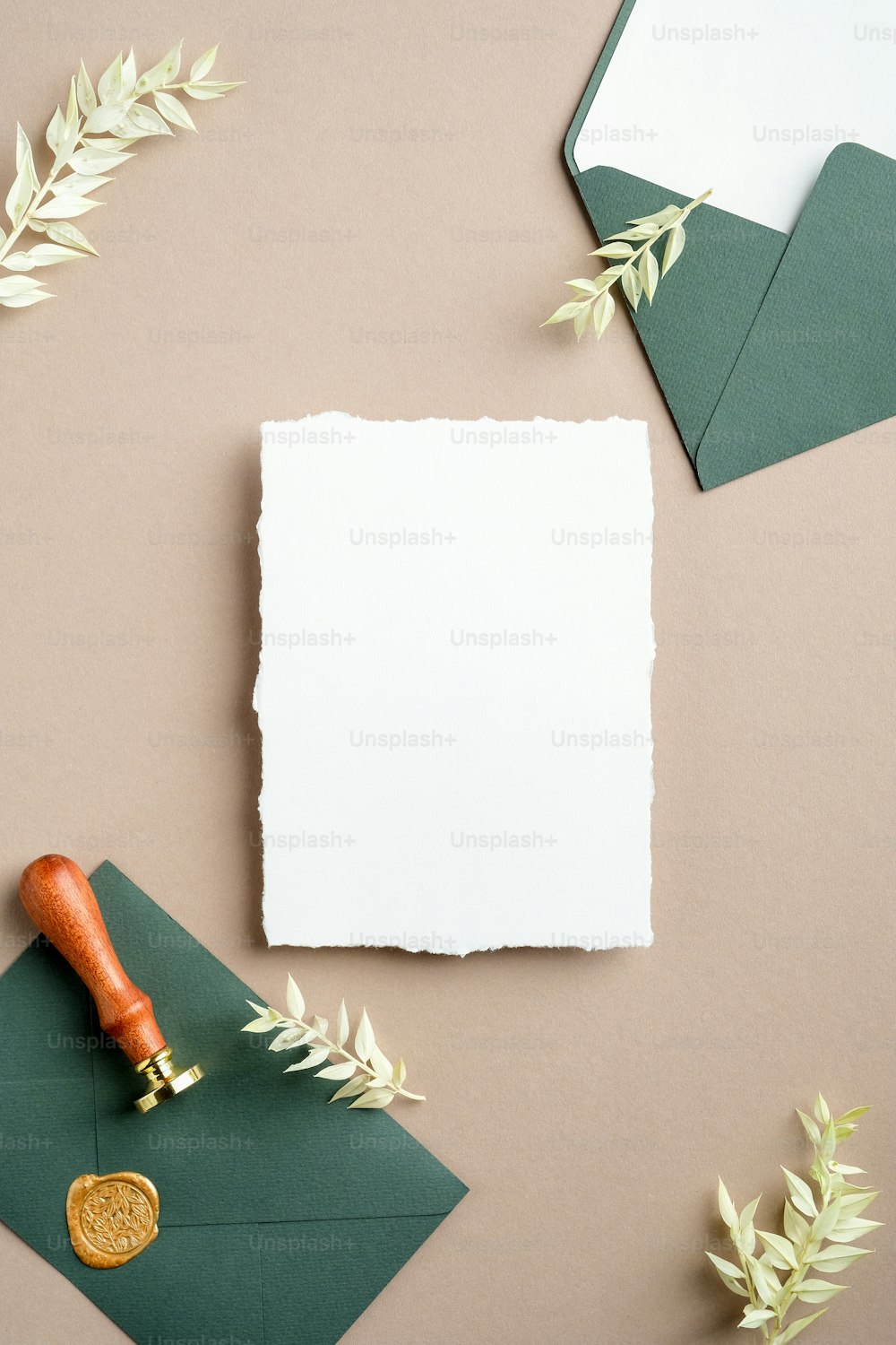 Wedding invitation card mockup with wedding details and dried flowers on pastel beige background. Flat lay, top view.