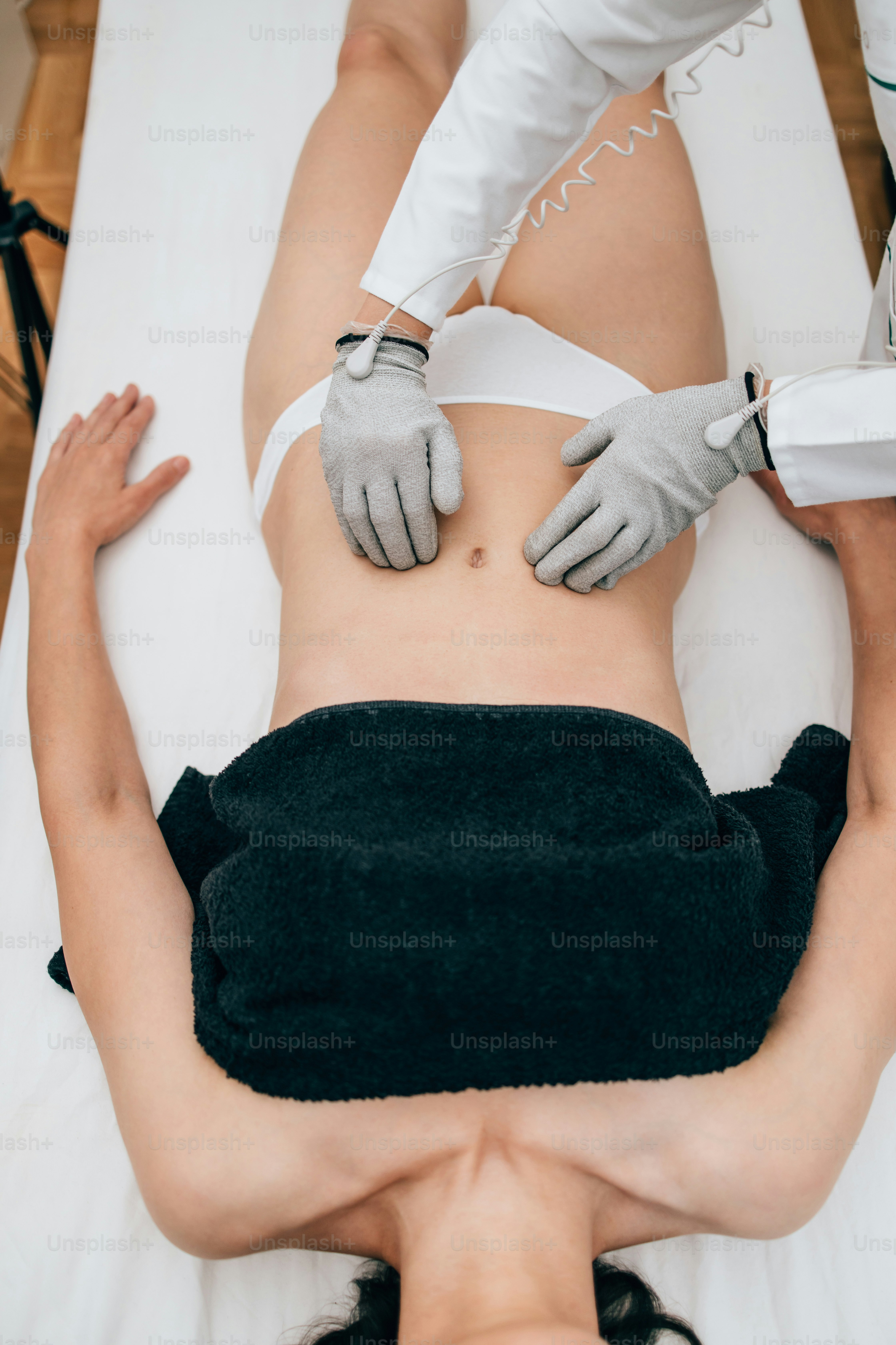 Micro sensory electrical BIO EMS microcurrent treatment for face and body electro stimulation and muscle toning. Anti wrinkle and anti-aging lifting. Alternative therapy with conductive gloves.