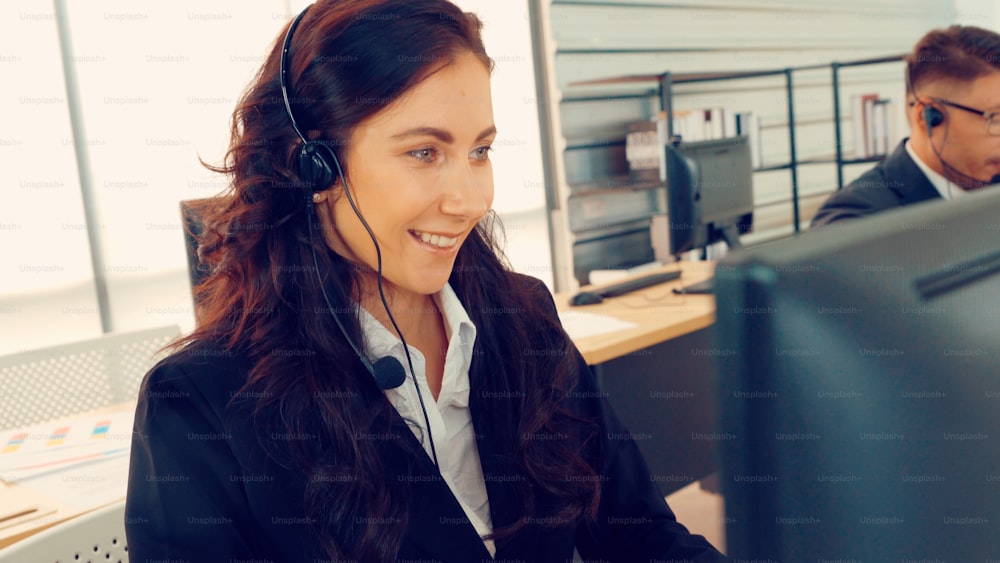Group of business people wearing headset working actively in office. Call  center, telemarketing, customer support agent provide service on telephone  video conference call. 31608094 Stock Photo at Vecteezy