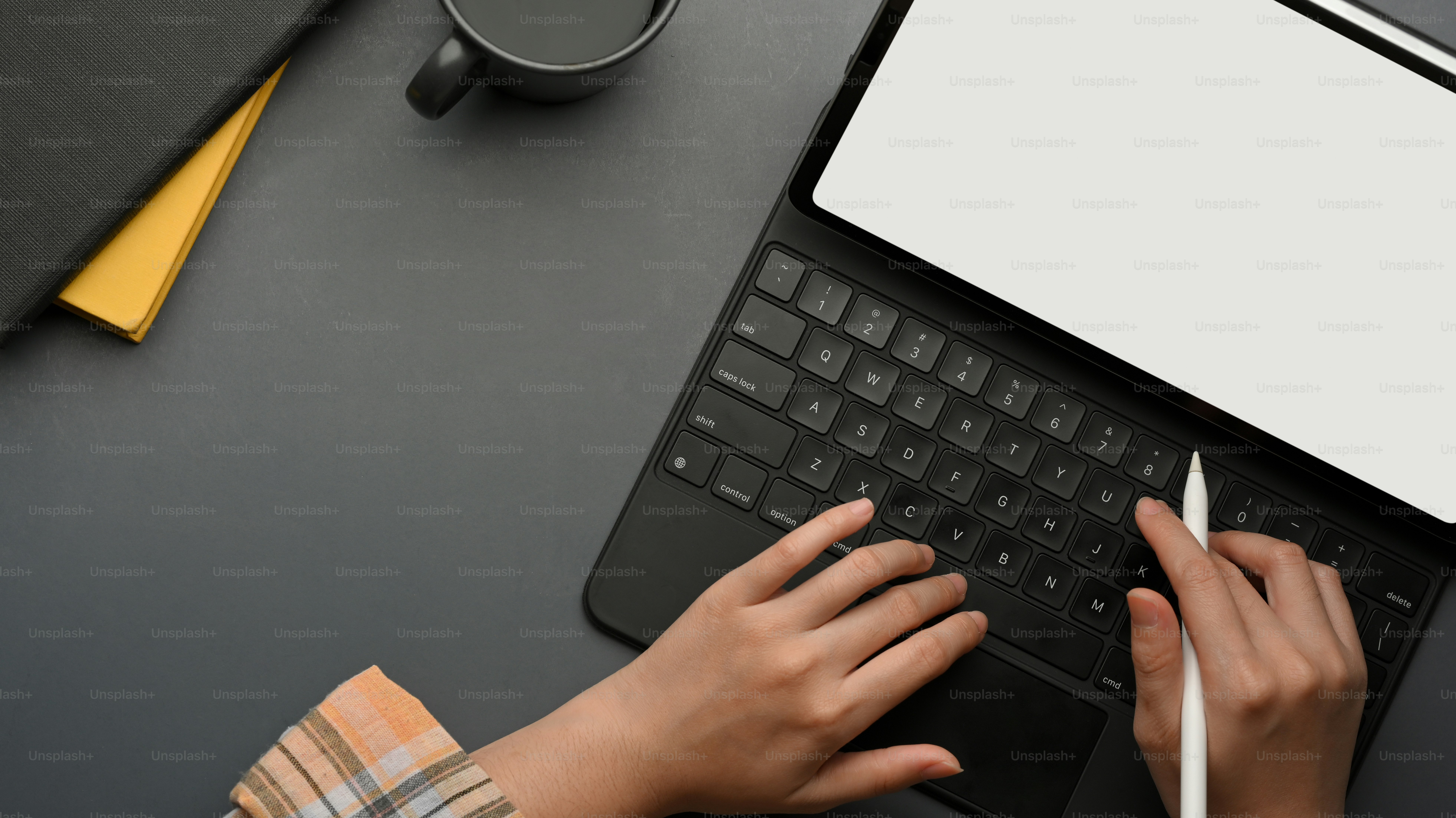 Top view of female freelancer hands typing on tablet keyboard while ...
