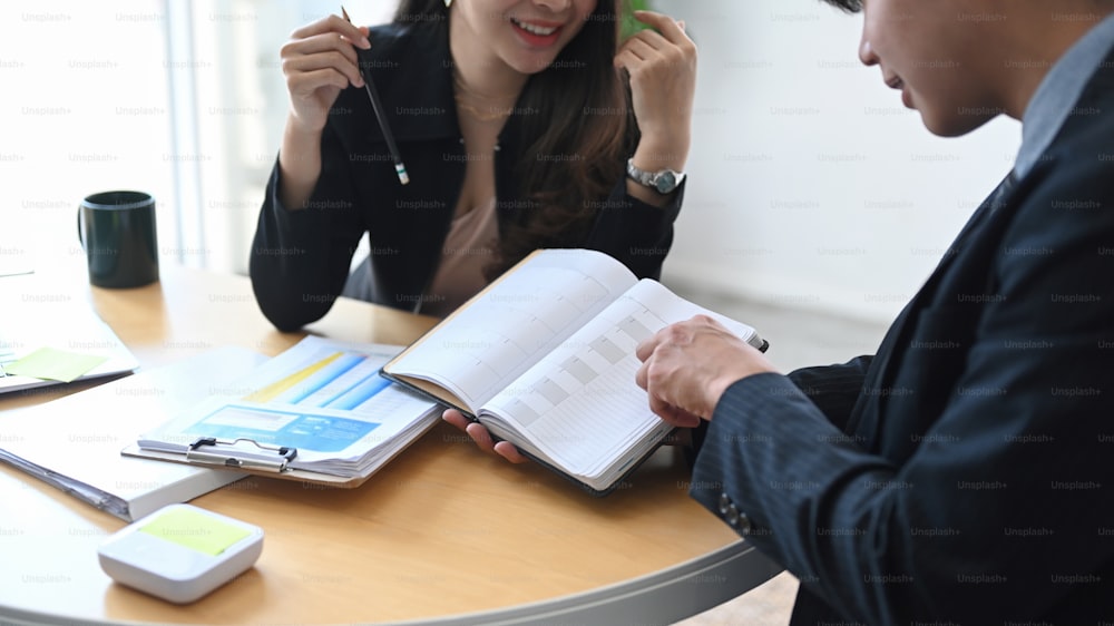 Cropped shot of business people discussing ideas of project about company offer and planning their project ay office.