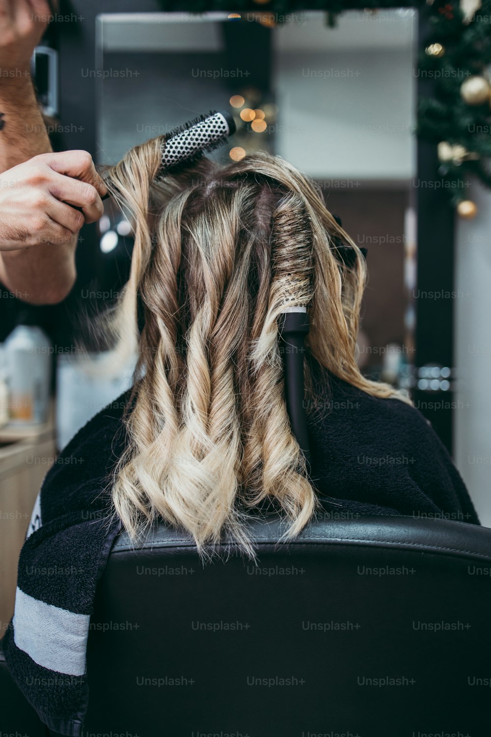 Premium Photo  Hairdresser is dying female hair, making hair