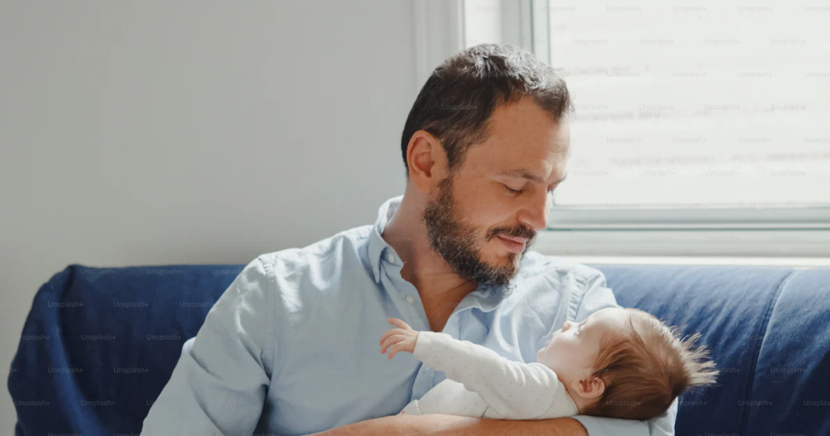 Proud Caucasian father with newborn baby. Parent holding rocking child ...