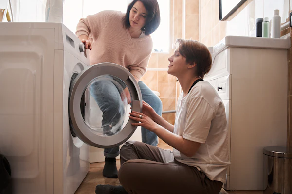 Happy customer after a successful washing machine repair