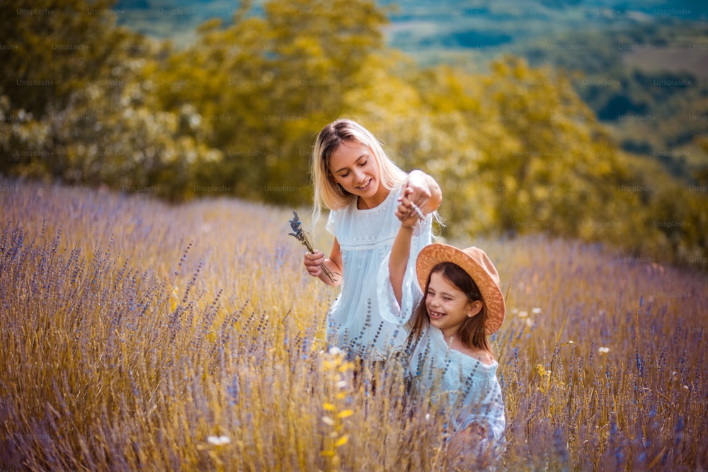 Mother and daughter  in lavender field.