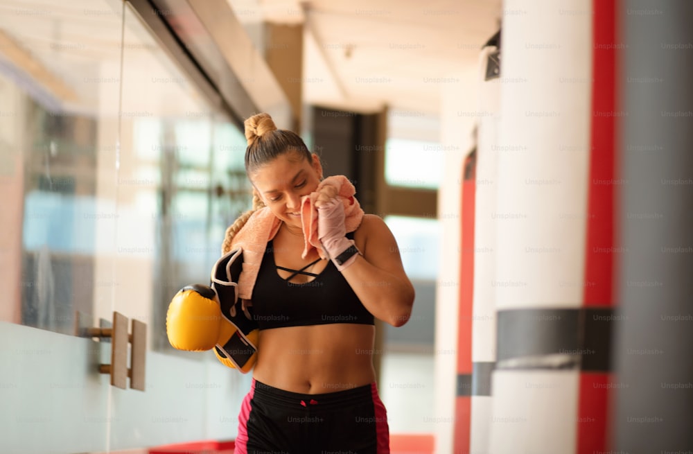 Boxer woman in gym.