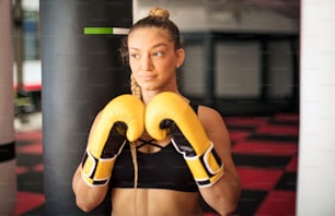 Woman boxer in gloves.