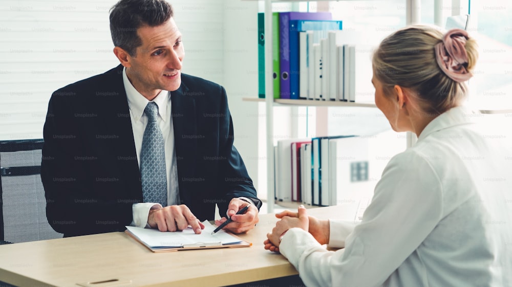 Job seeker in job interview meeting with manager and interviewer at corporate office. The young interviewee seeking for a professional career job opportunity . Human resources and recruitment concept.