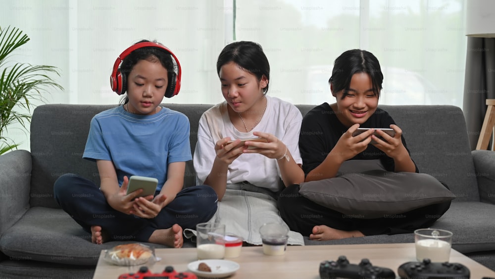 Three asian girl sitting in comfortable sofa and enjoy leisure weekend together.