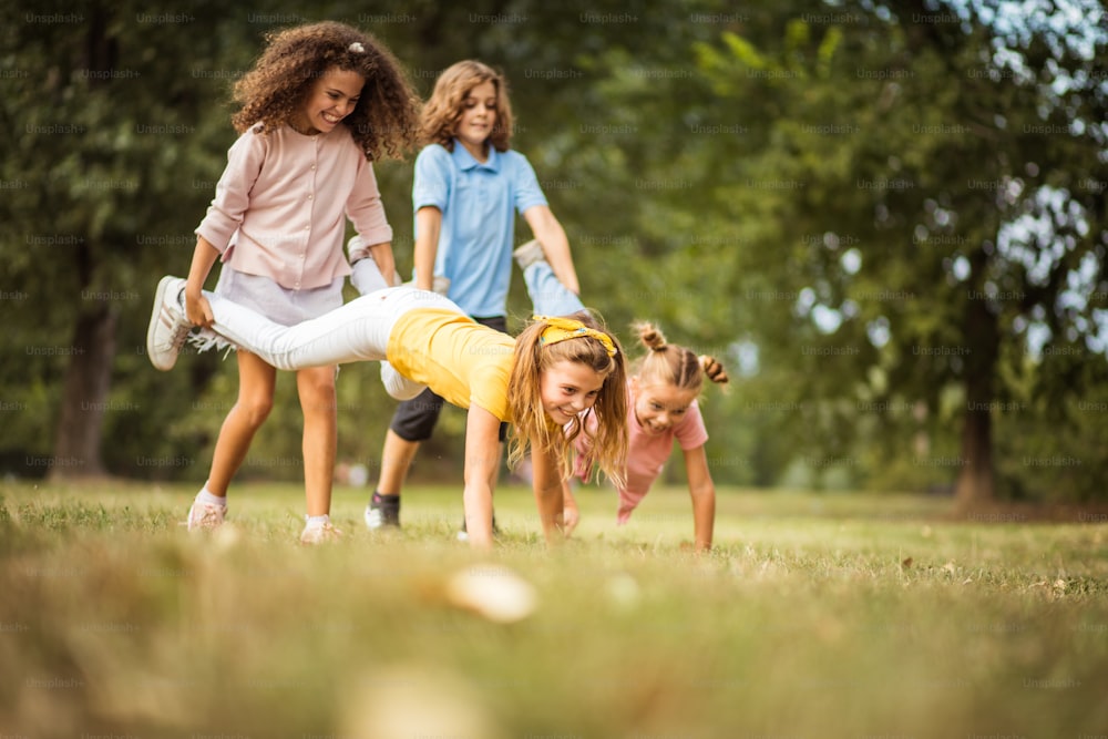 Fun time.  Group of school kids having fun in nature.