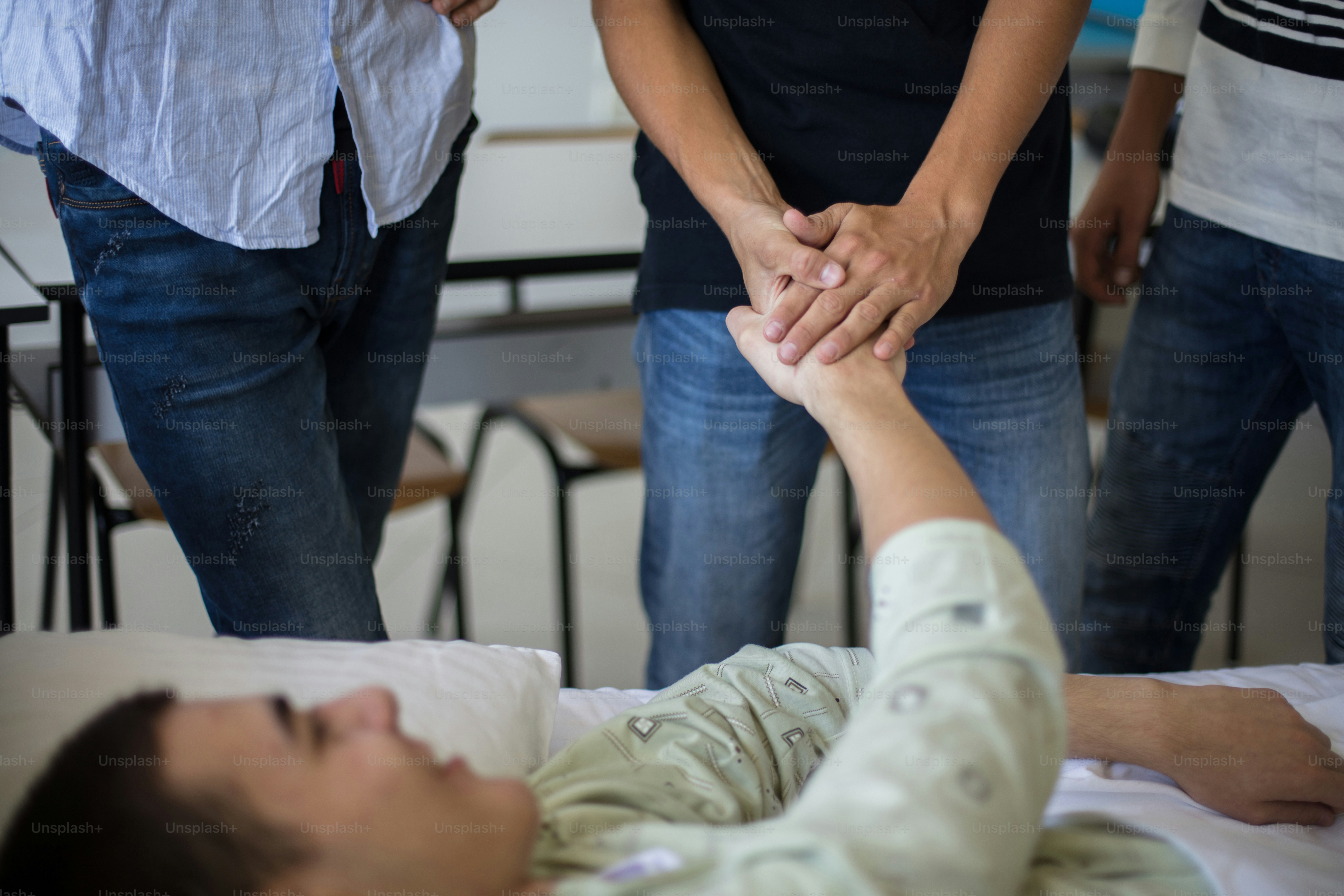 Support.  Family and friends visiting patient. Focus is on background.