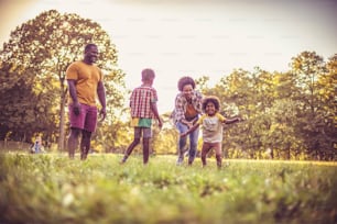 African American family having fun outdoors.