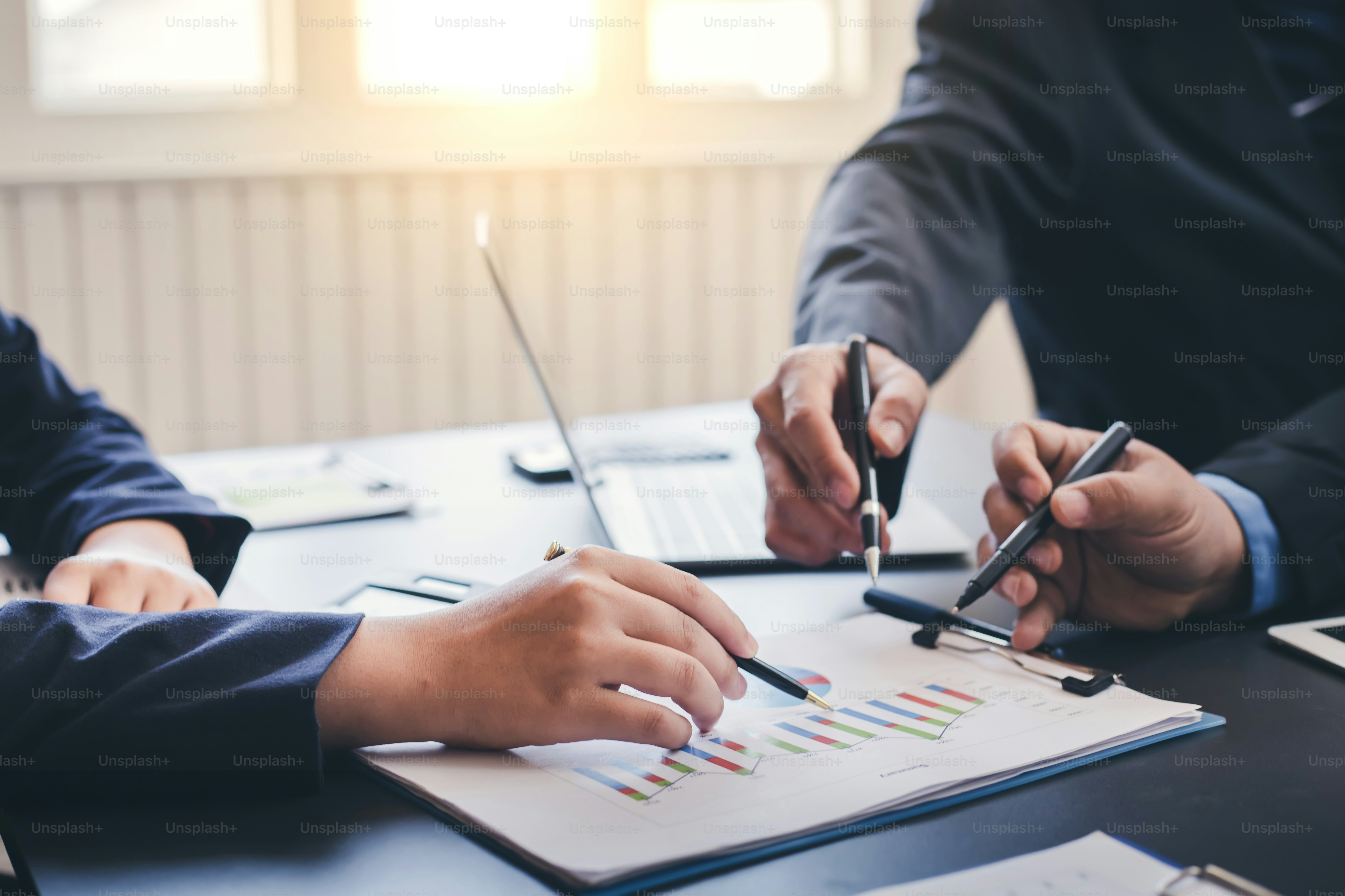 Business people discussions and summary financial information at meeting