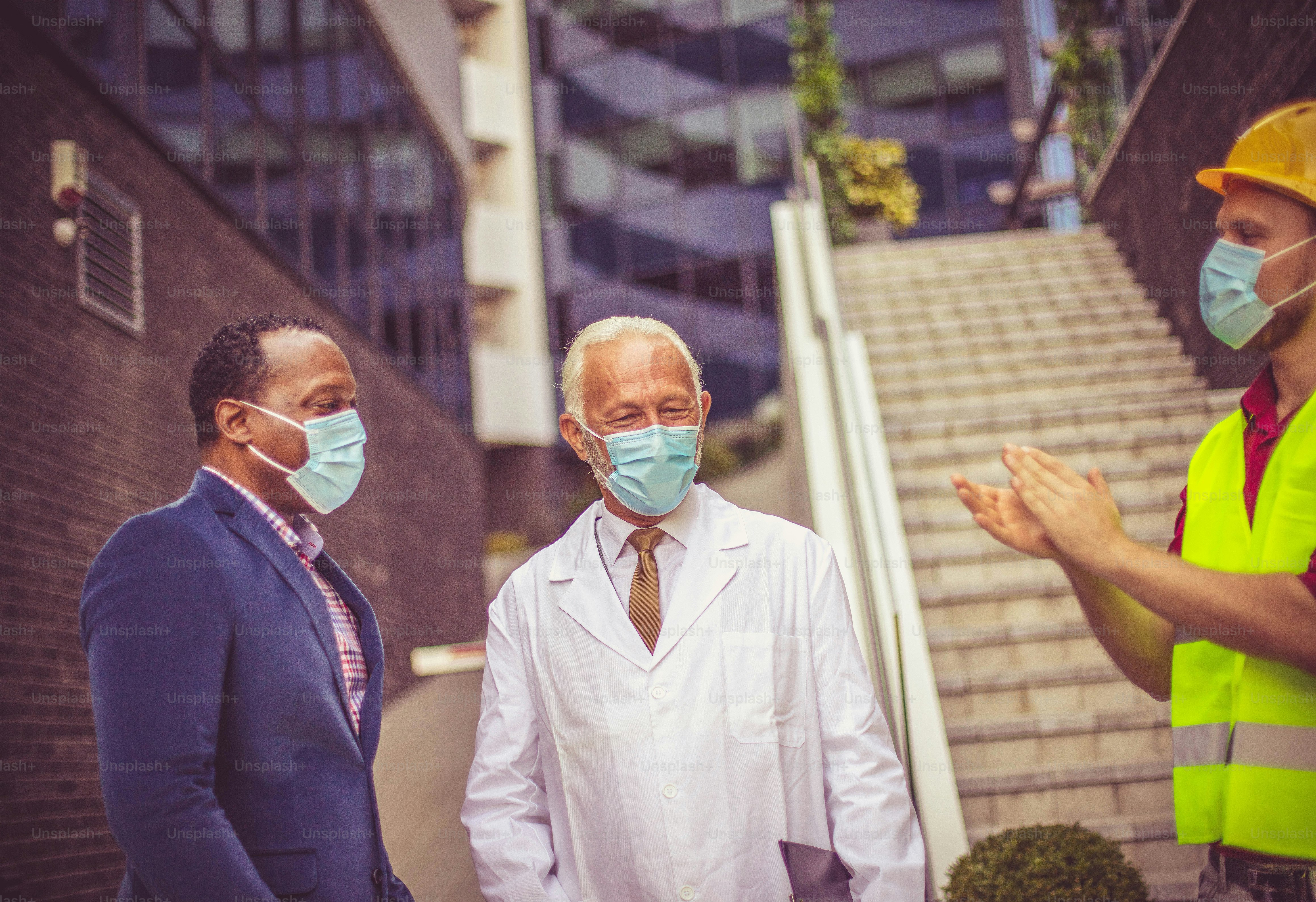 Business man, doctor and engineer on street