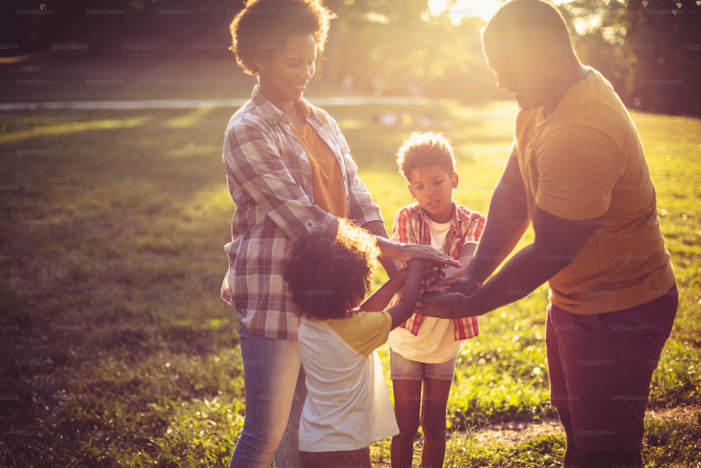 African parents playing with their children in nature.